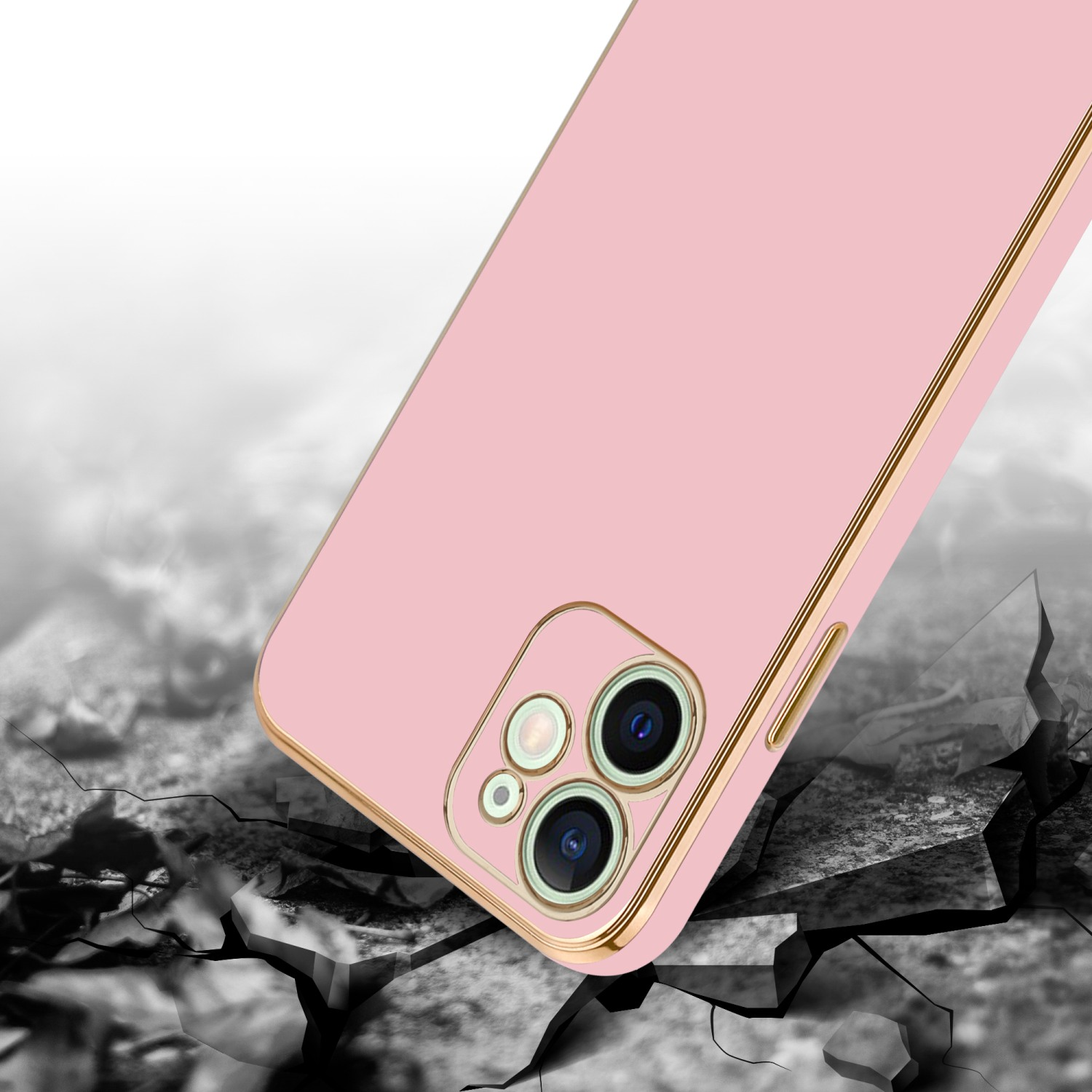 Eine pinke Handyhülle mit goldenem Rand auf einer zerbrochenen Oberfläche, mit grauem und weißem Hintergrund.