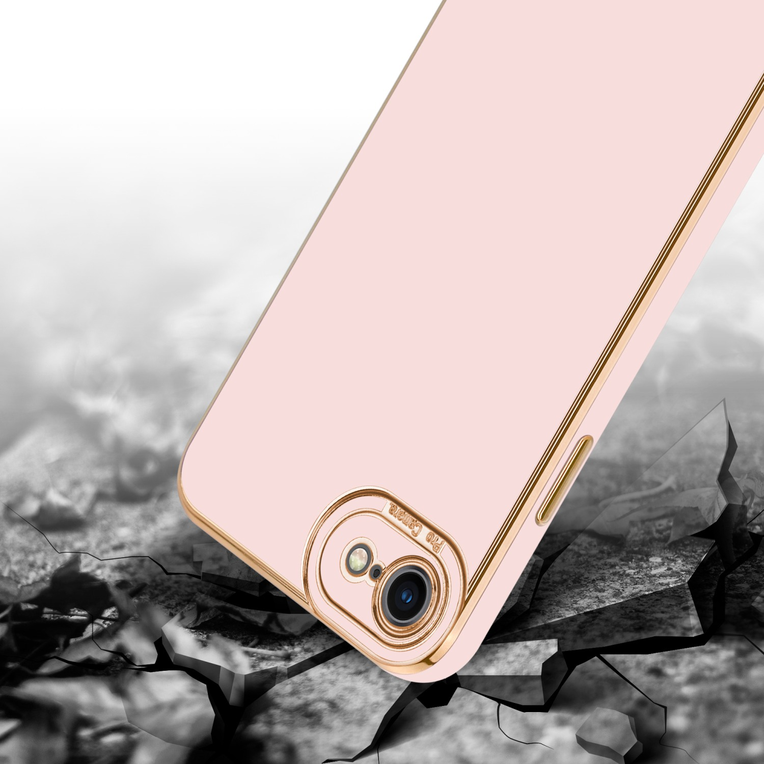 Eine rosa Handyhülle mit goldfarbenem Rand liegt auf einer zerbrochenen Oberfläche. Die Kamera ist sichtbar.