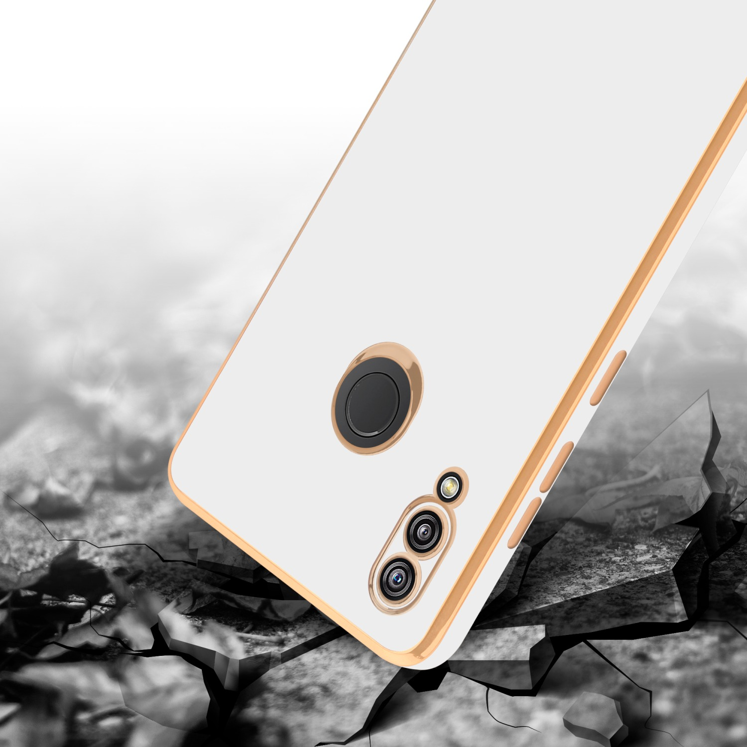 Ein weißes Telefon mit goldenem Rahmen fällt auf eine zerbrochene Oberfläche. Das Telefon hat eine schwarze Kameralinse.