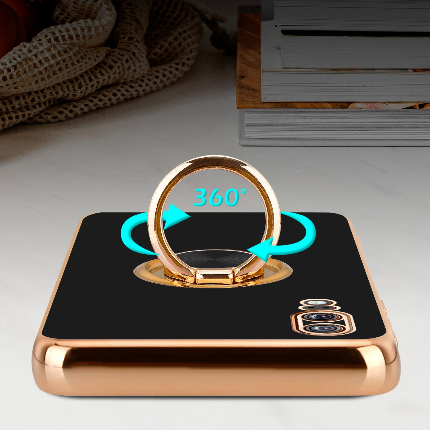 Schwarze Handyhülle mit goldenem Ringhalter und 360°-Dre Pfeilen.