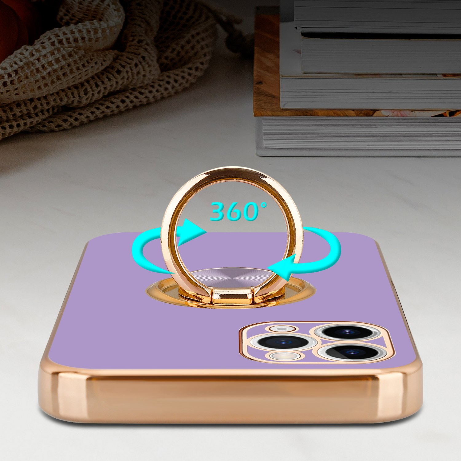 Lila Telefon mit einem goldenen Ringhalter. Der Ring wird um das Telefon gedreht. Text 360 Grad.