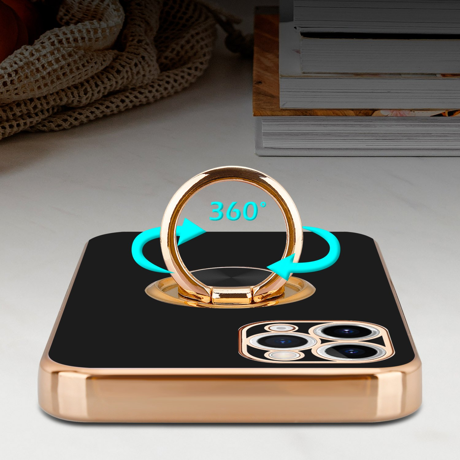 Ein Telefon mit schwarzer Hülle und goldenem Ring. Der Ring hat blaue Pfeile darum. Der Hintergrund ist unscharf.