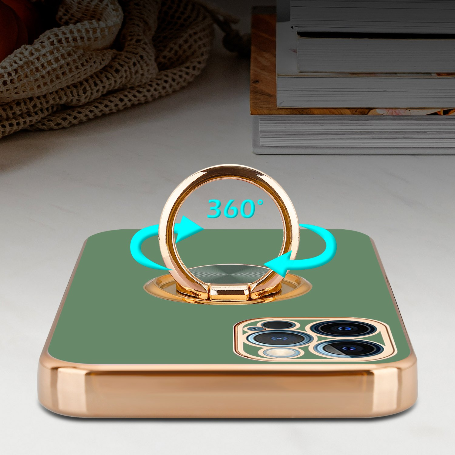Eine Handyhülle mit einem goldenen Ringhalter. Das Telefon ist grün mit einem goldenen Rahmen. Pfeile um den Ring.