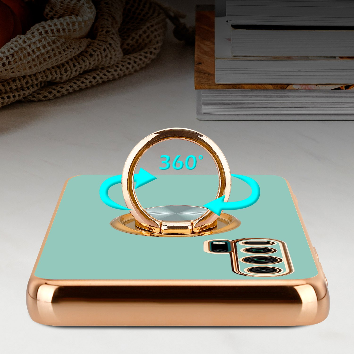 Eine Handyhülle mit goldenem Ring, mit goldenem Gehäuse und einer 360-Grad-Rotationsmarkierung.