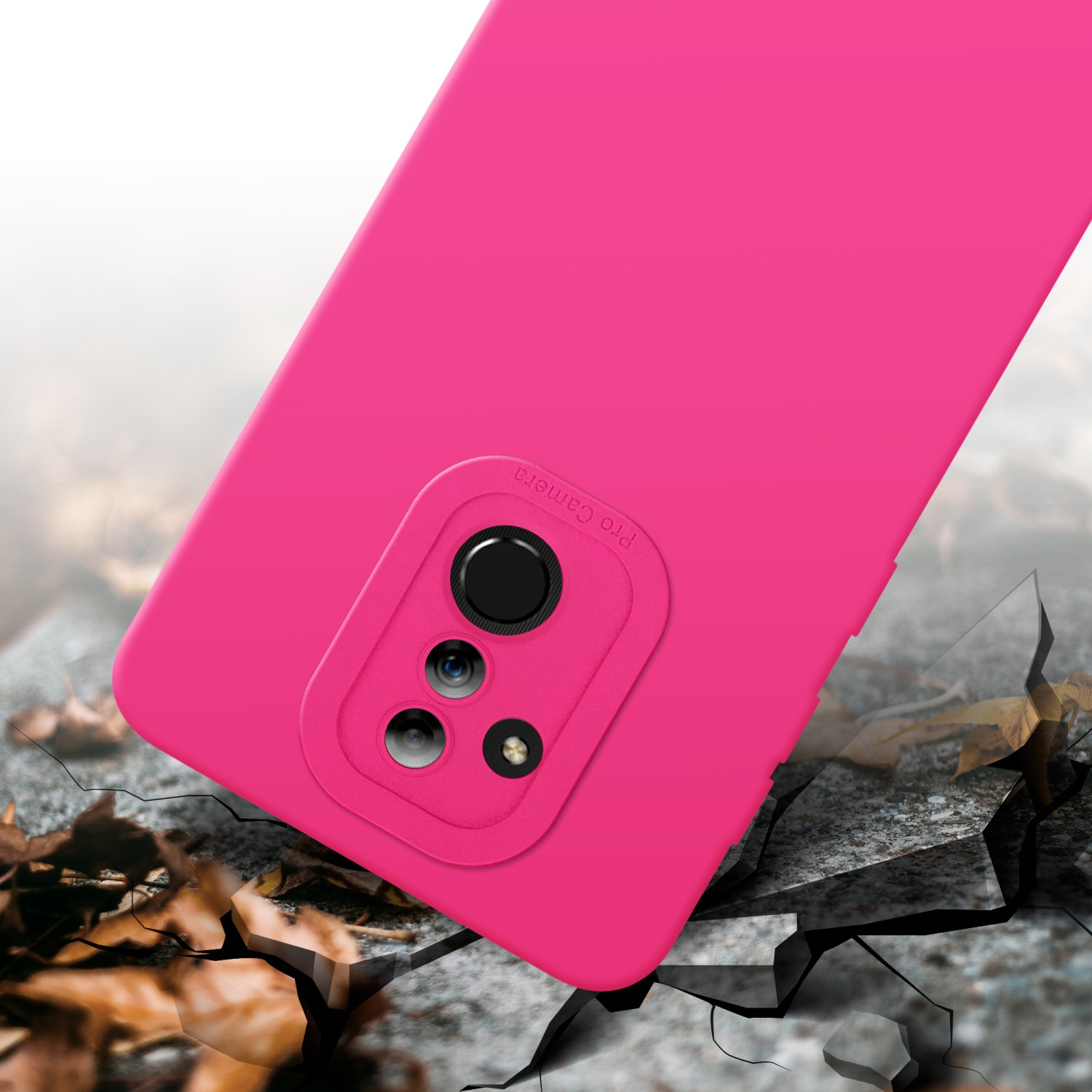Custodia rosa su terreno crepato. Pro Camera con più obiettivi visibili.