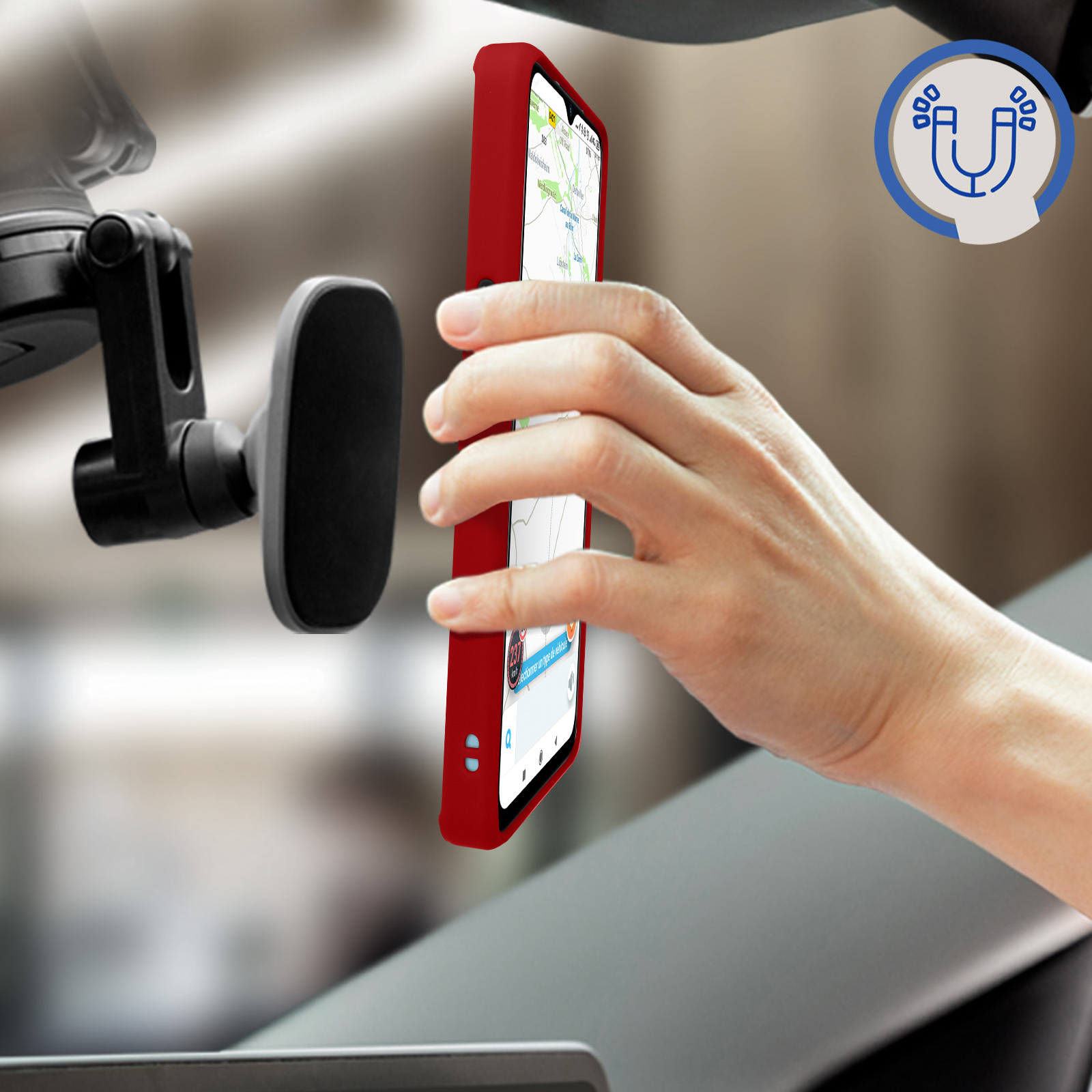 Un telefono rosso in un supporto per auto, che mostra un'app di navigazione sullo schermo.