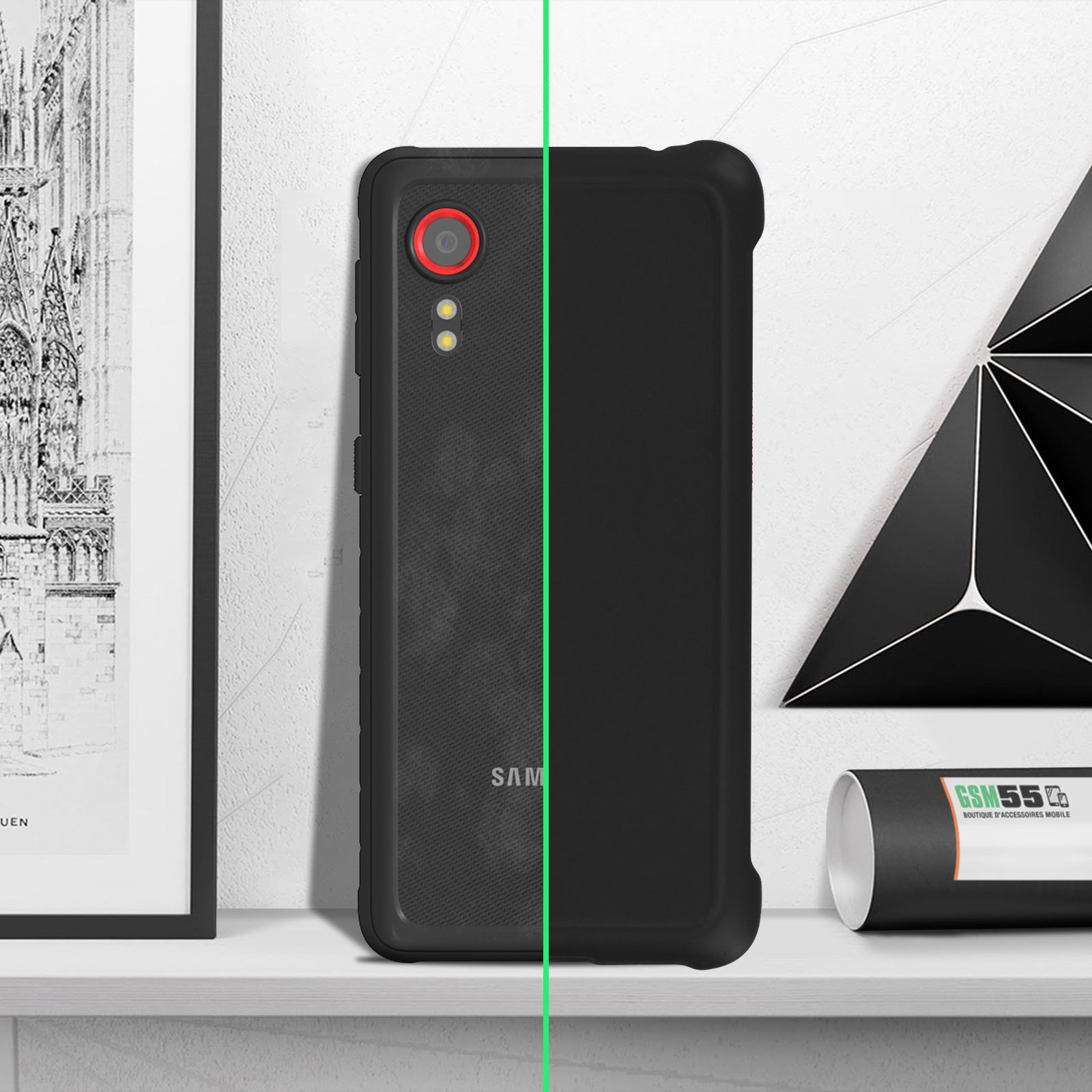 Telefono nero con lente rossa. È su una mensola bianca, con arte e un tubo.