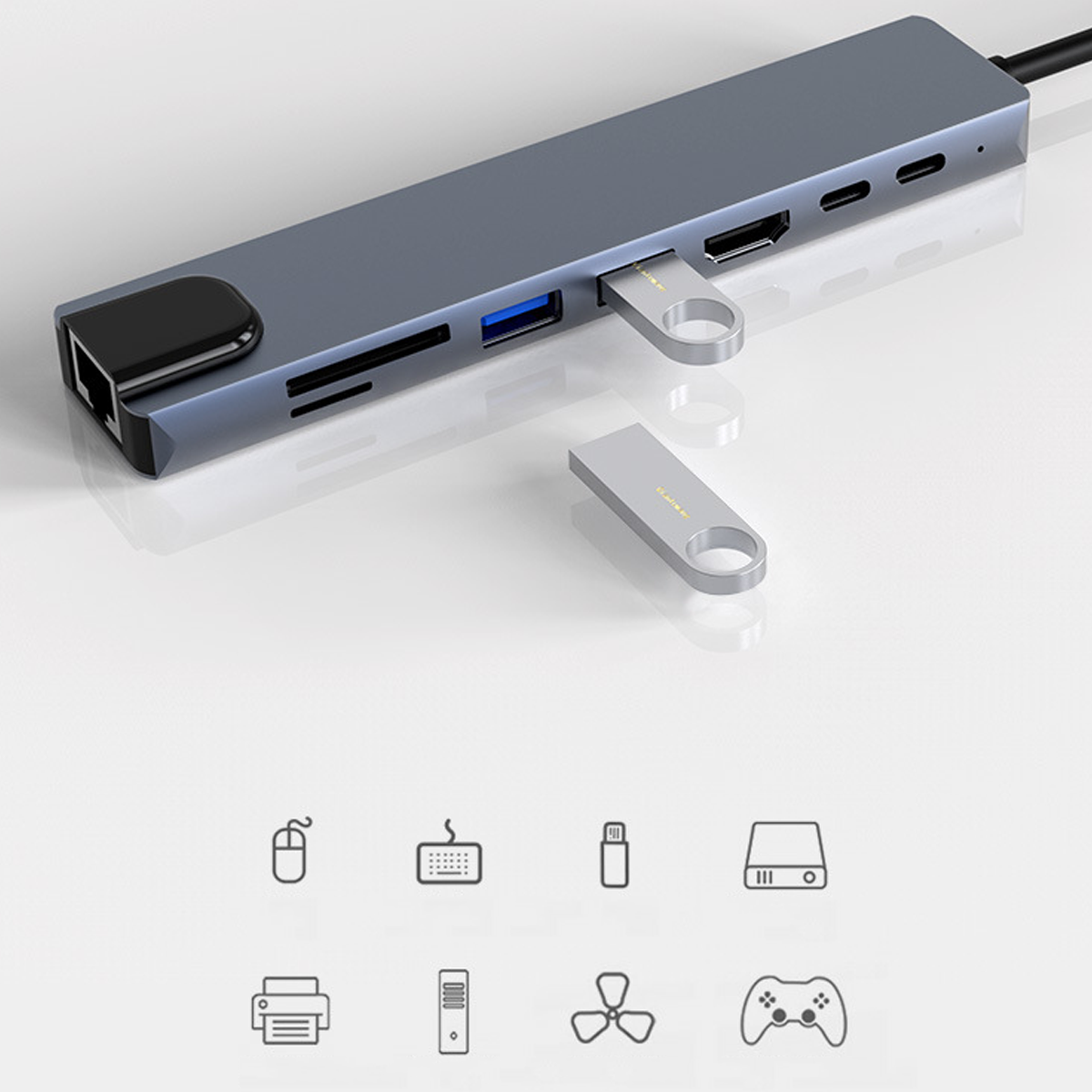 Ein grauer USB-Hub mit verschiedenen Anschlüssen und zwei USB-Laufwerken. Symbole von Geräten sind unten.