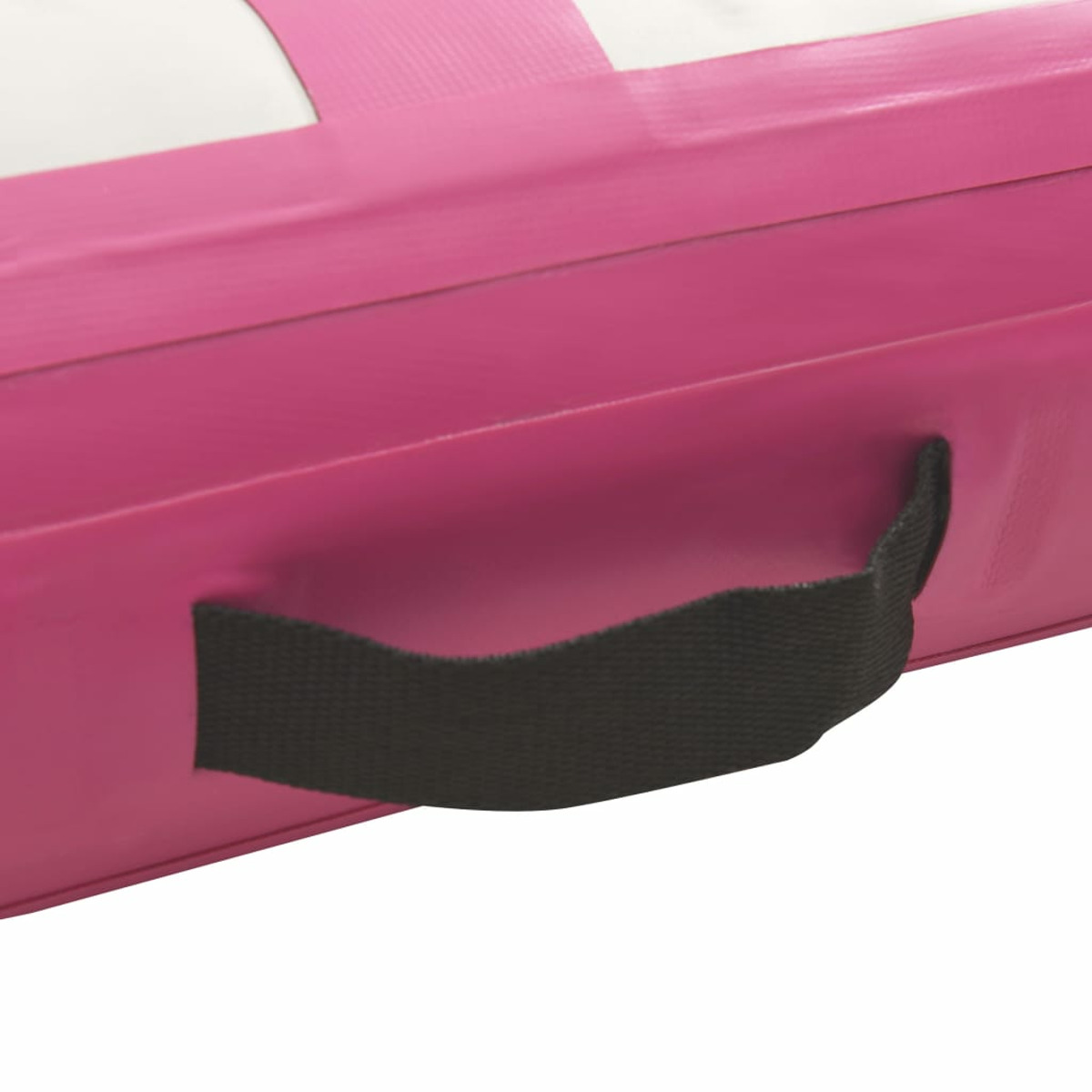 Materassino da palestra rosa con maniglia nera. La maniglia è in cinghia nera.