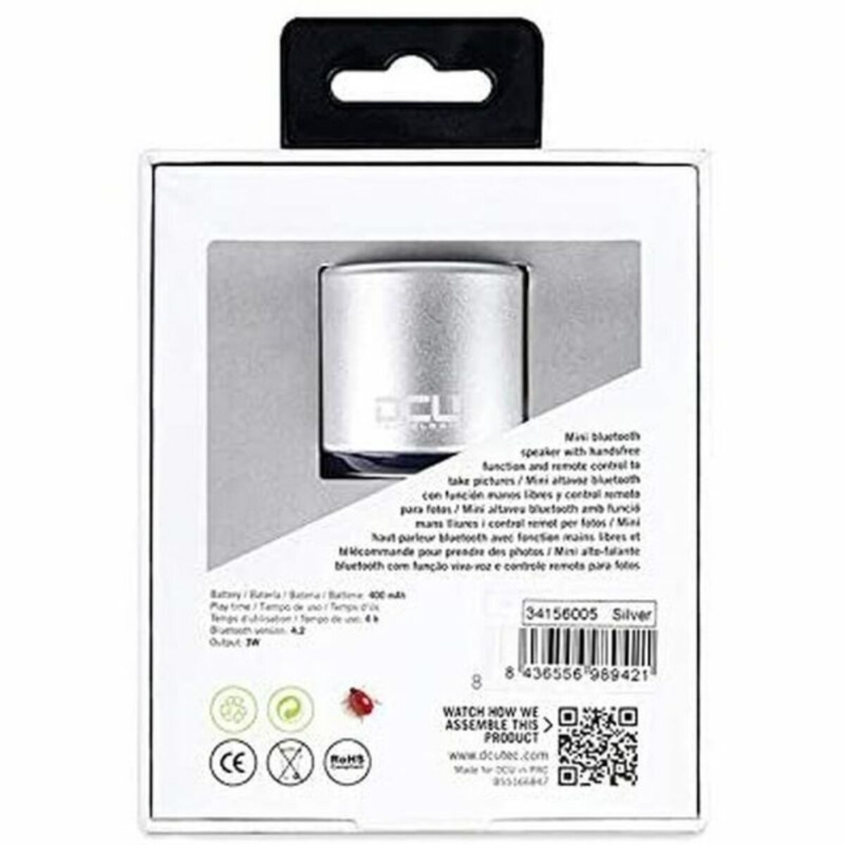 Białe pudełko ze srebrnym mini głośnikiem bluetooth. Tekst i ikony wydrukowane z tyłu.