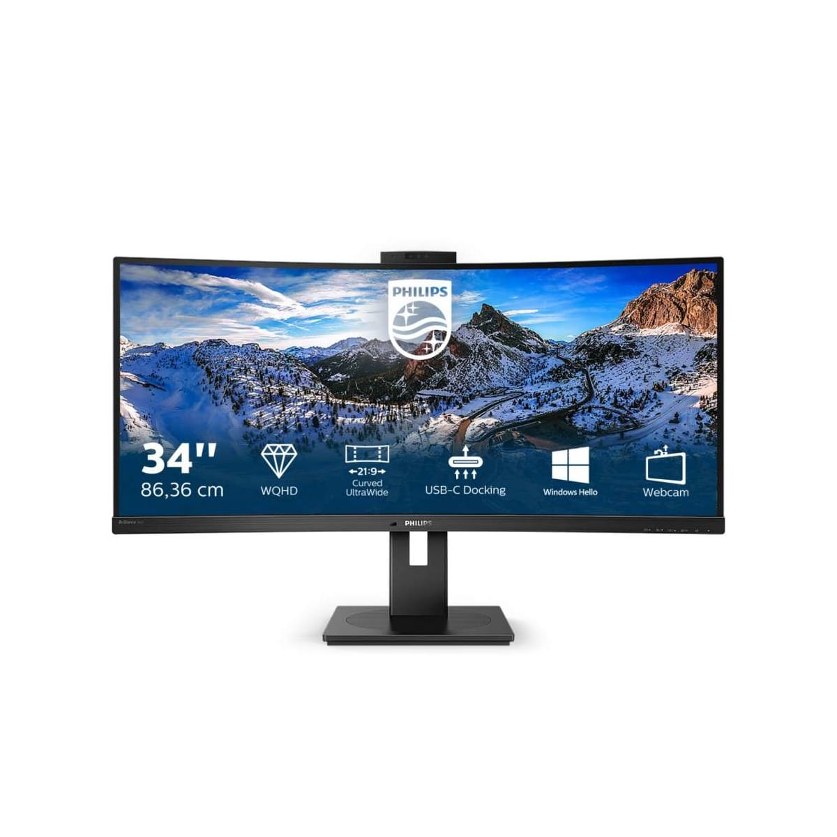 Zakrzywiony monitor Philips, czarny stojak, obraz góry i nieba na ekranie.