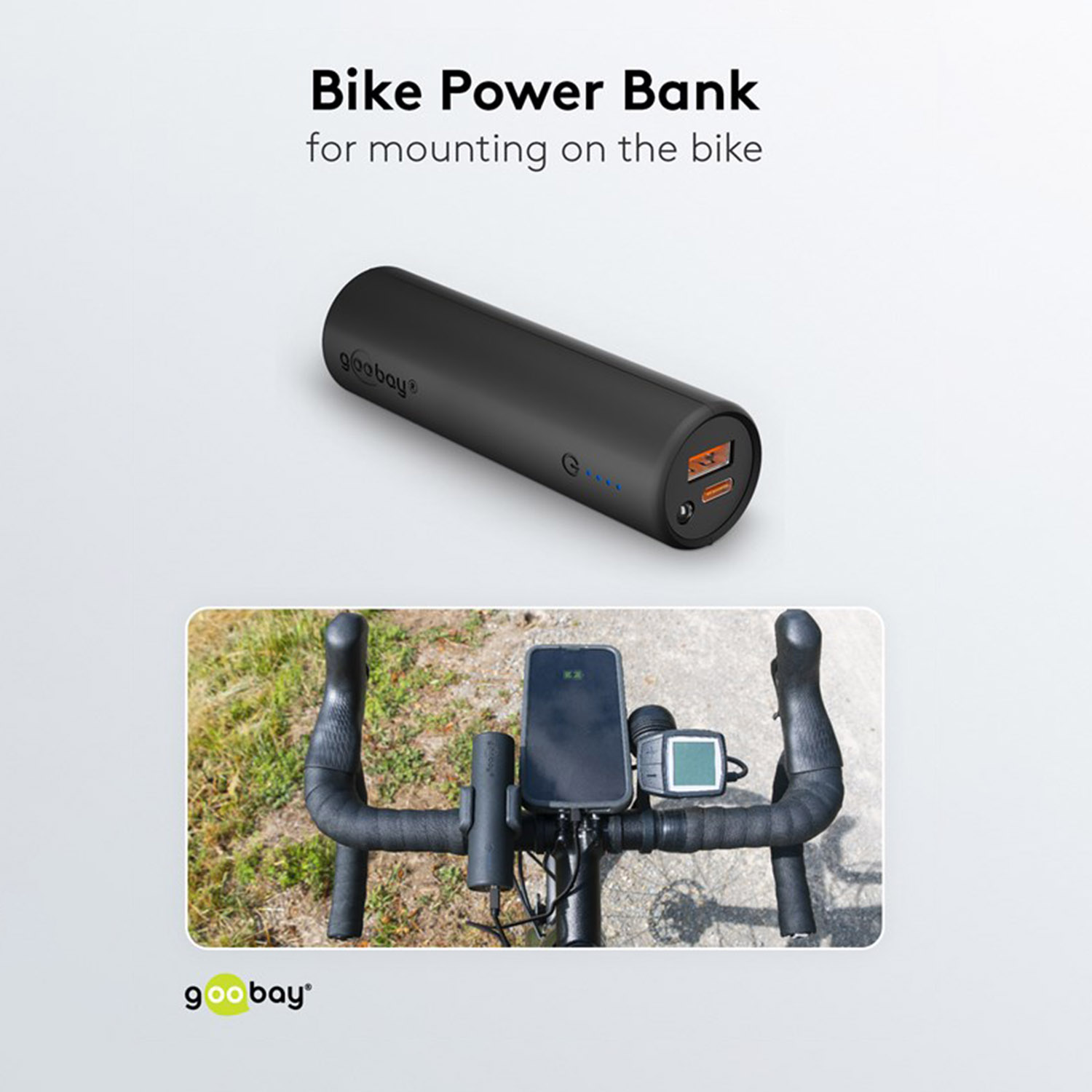 Batería externa negra para bicicleta con puertos naranjas y manillar de bicicleta con teléfono y pantalla.