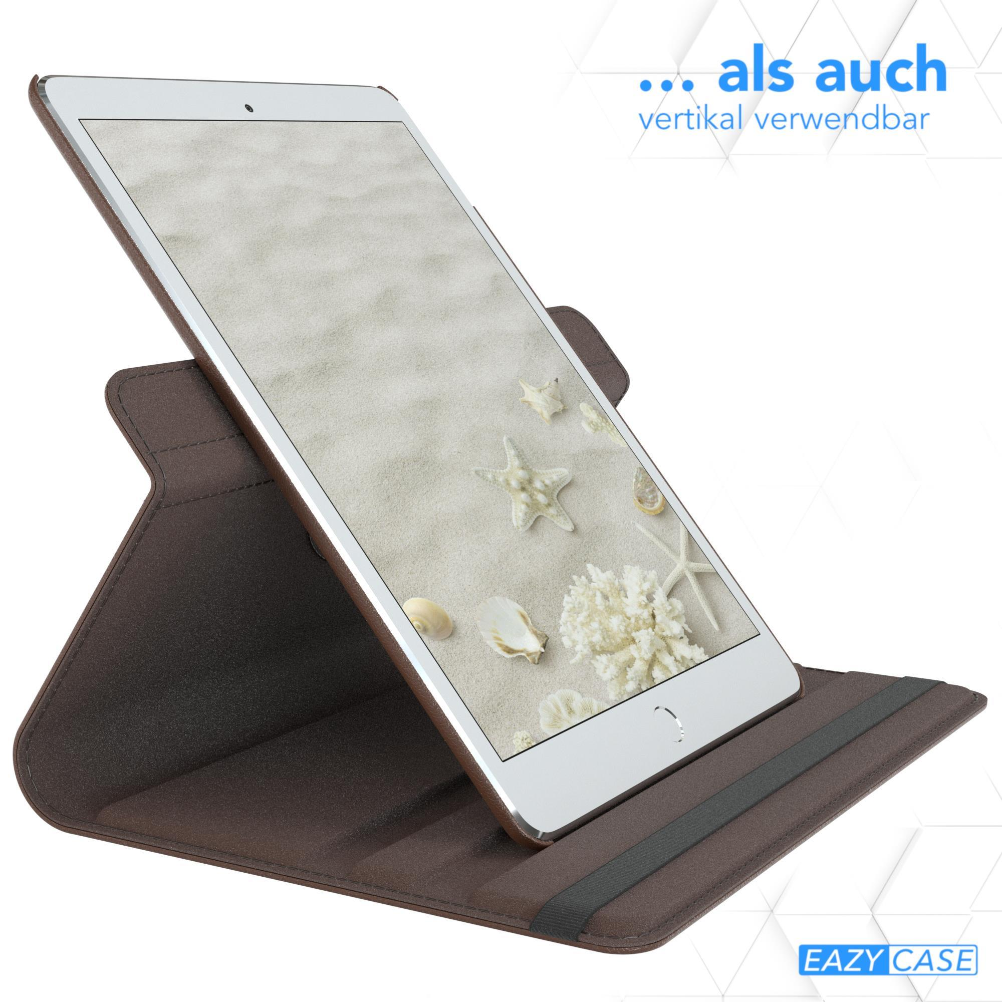 Ein Tablet in einem braunen Gehäuse liegt auf einem Tisch. Das Tablet zeigt einen Sandstrand mit Muscheln.