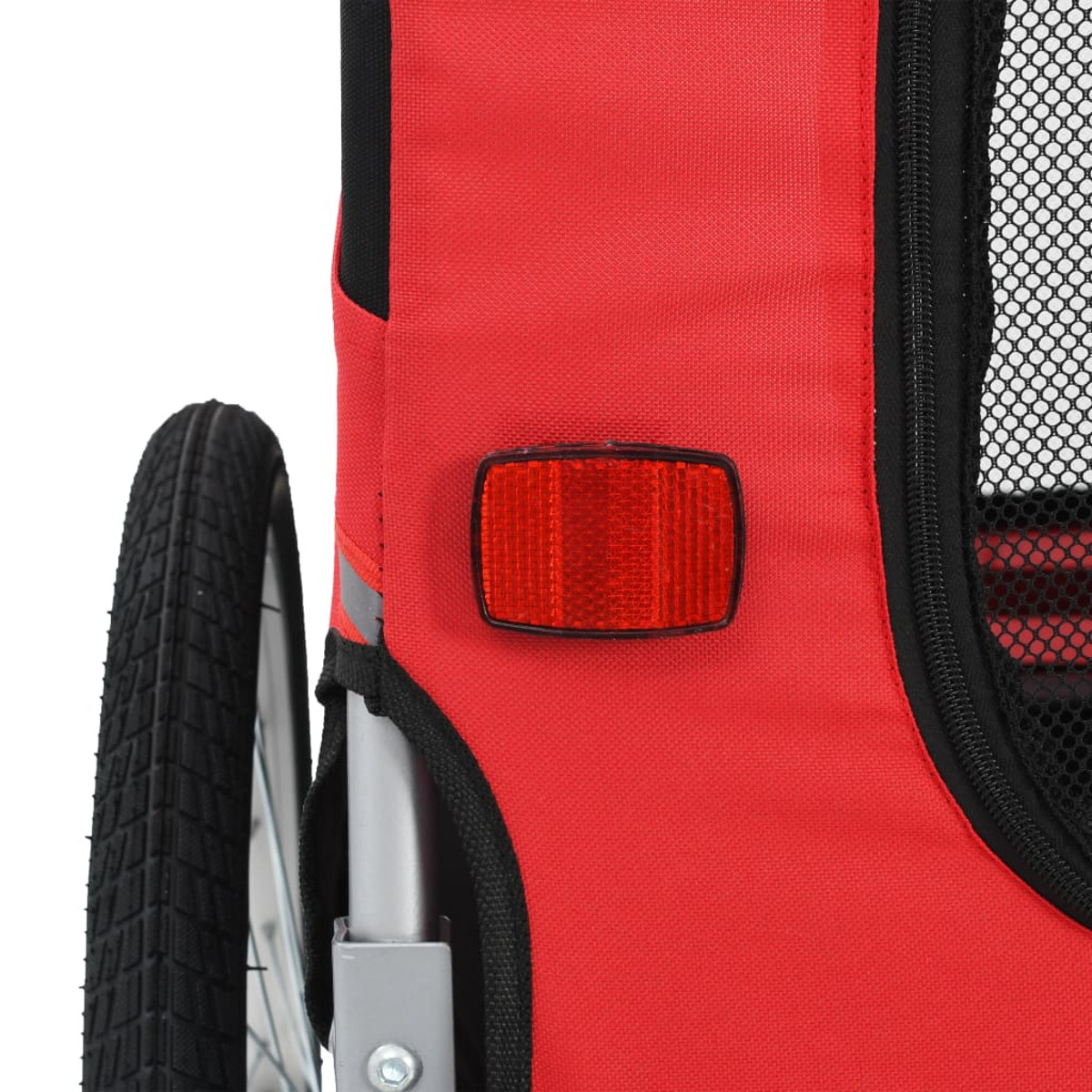 Roter Fahrradanhänger mit Rad links, rotem Reflektor in der Mitte und schwarzem Netz.