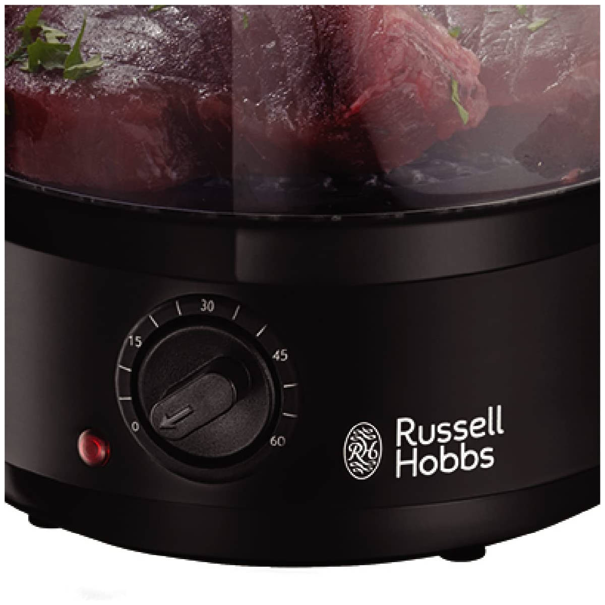 Vaporera de alimentos Russell Hobbs negra con perilla de temporizador. Tiene tapa de vidrio y luz roja.