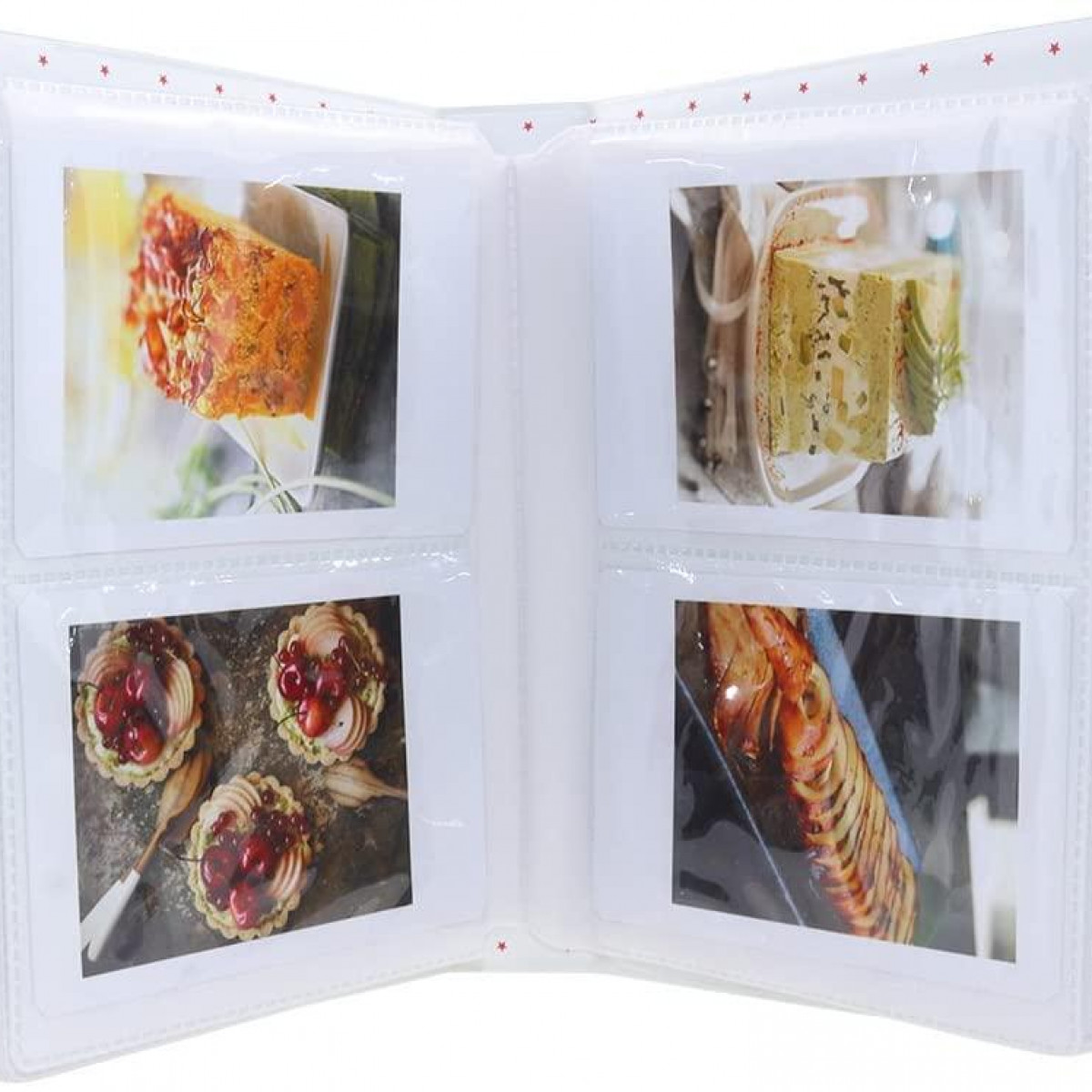 Fotoalbum geöffnet, zeigt Fotos von Essen.
