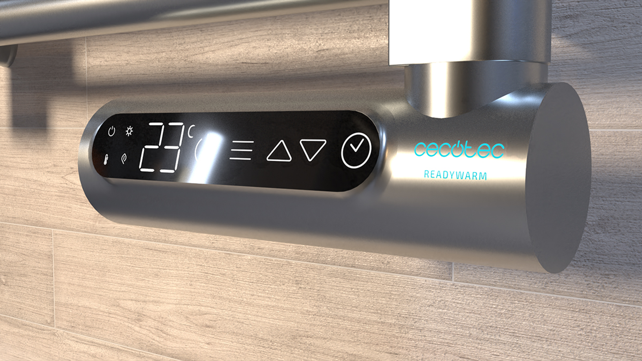 Srebrna, nowoczesna suszarka do ręczników z cyfrowym wyświetlaczem pokazującym 23 stopnie. Na kafelkowej ścianie.