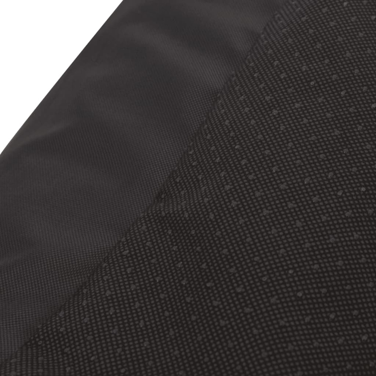 Schwarzes Stoffdetail mit zwei Texturen: glatt und gepunktet. Dunkle Farbtöne.