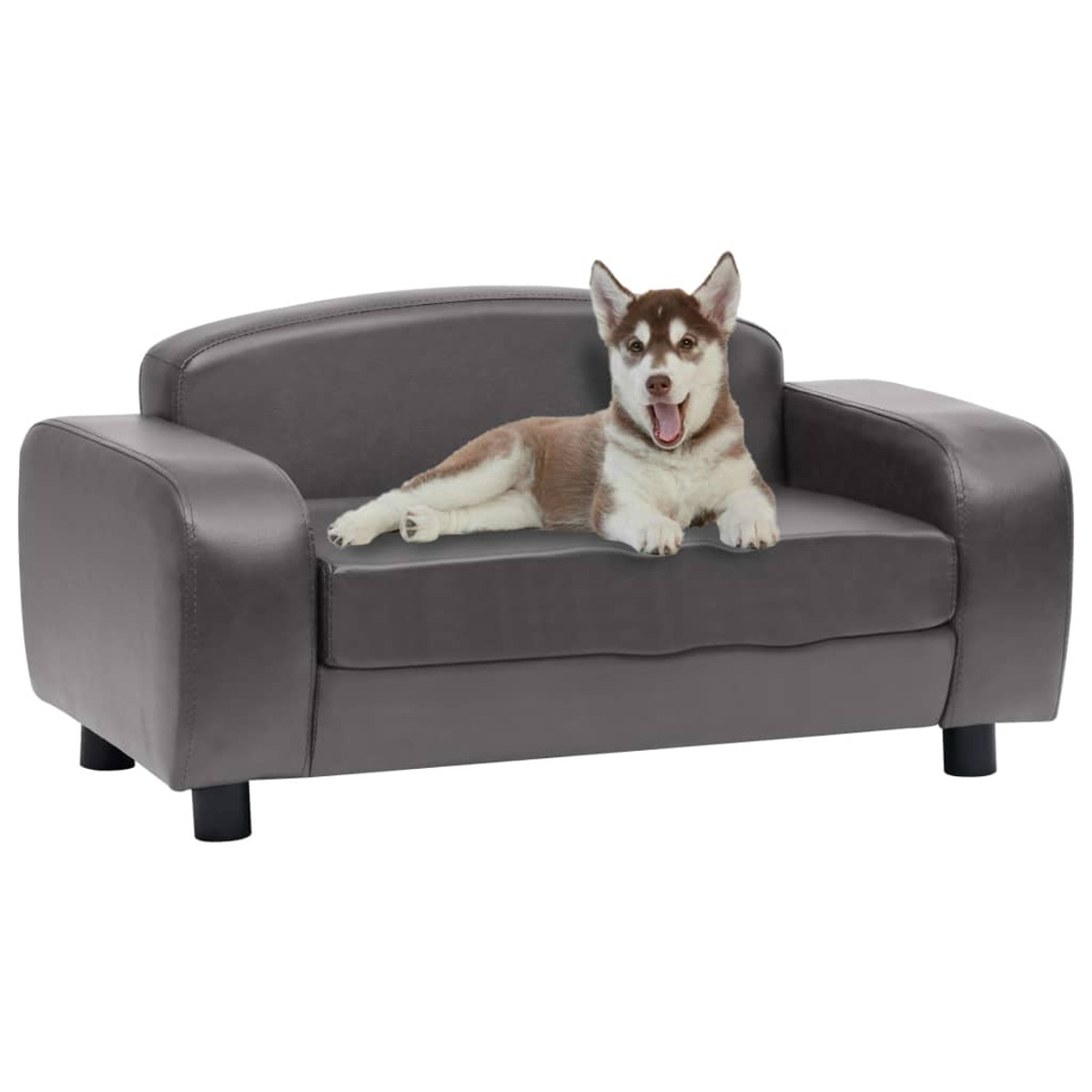 Ein graues Hundesofa mit einem Welpen, der darauf liegt und lächelt. Schwarze Beine.