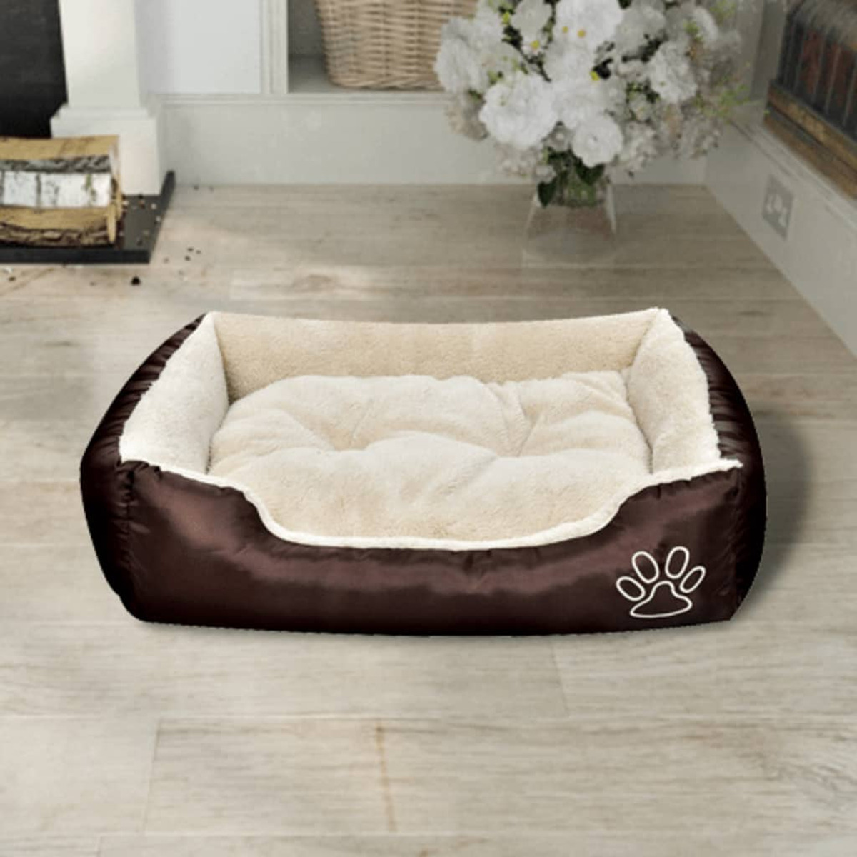 Braunes Hundebett mit weißem, flauschigem Innenraum. Pfotenabdruck auf dem Bett.