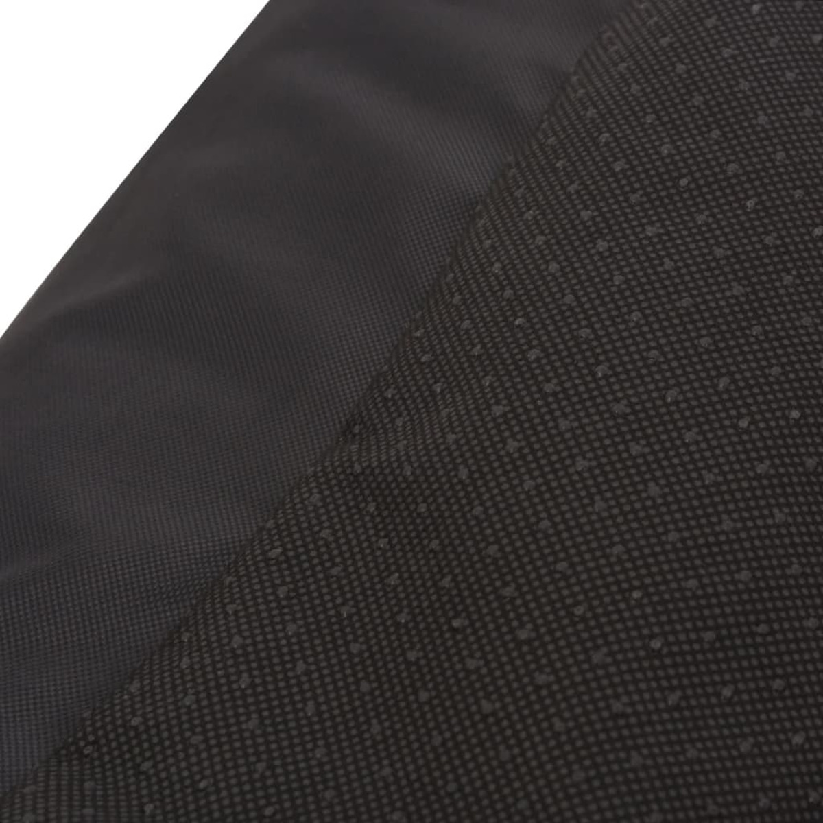 Zwei Stücke eines strukturierten schwarzen Materials. Eine Seite ist glatt, die andere gepunktet.