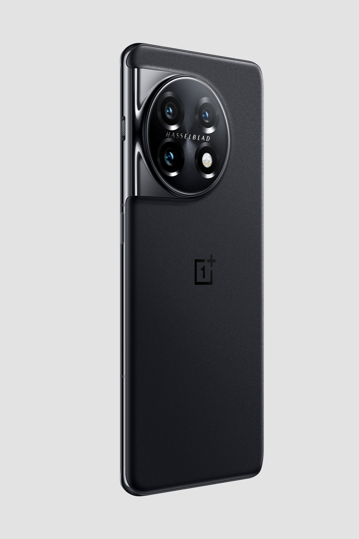 A black OnePlus phone with a large camera module and the Hasselblad logo. The phone is angled slightly.