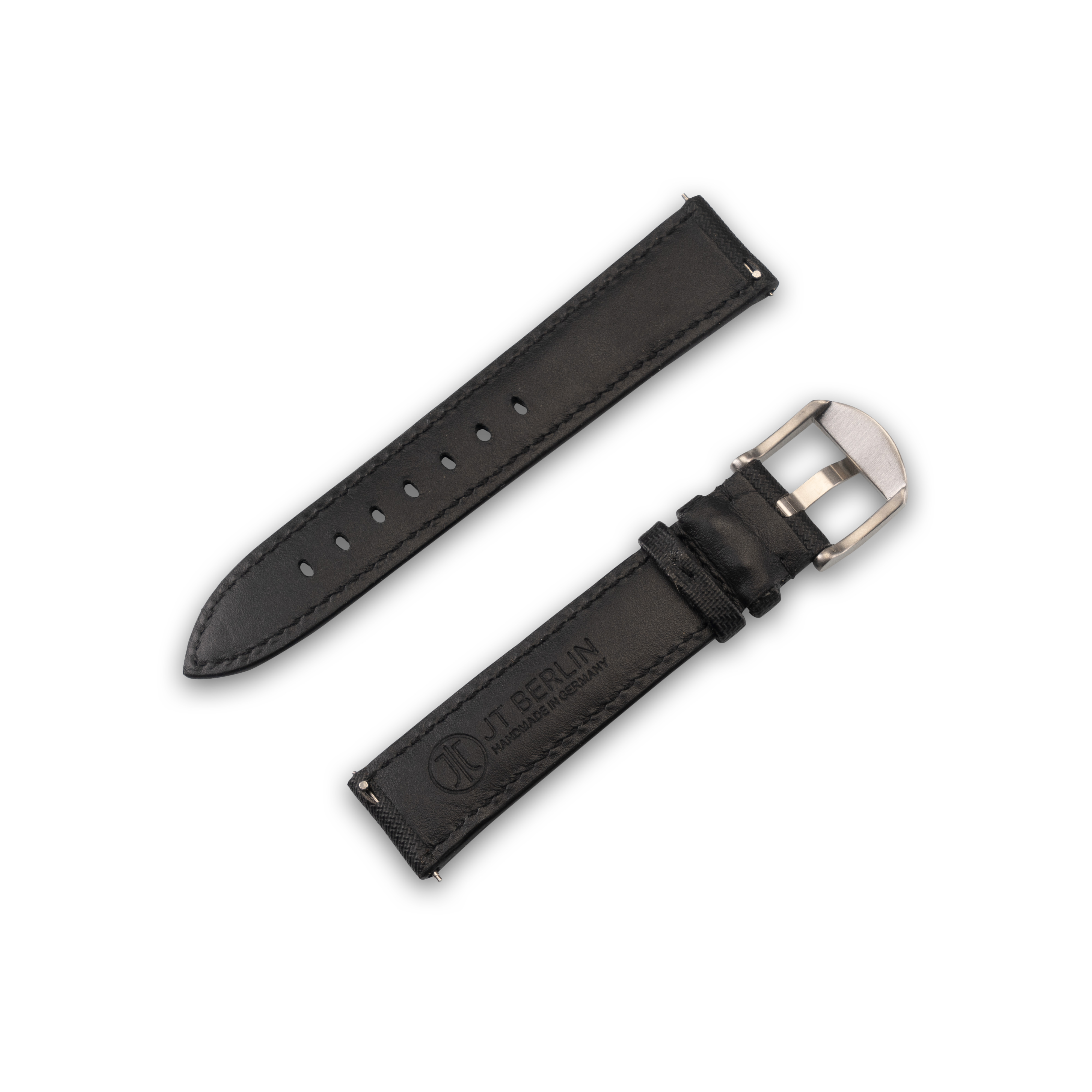 Zwei schwarze Leder-Armbänder mit silberner Schnalle. Ein Armband ist abgenommen.