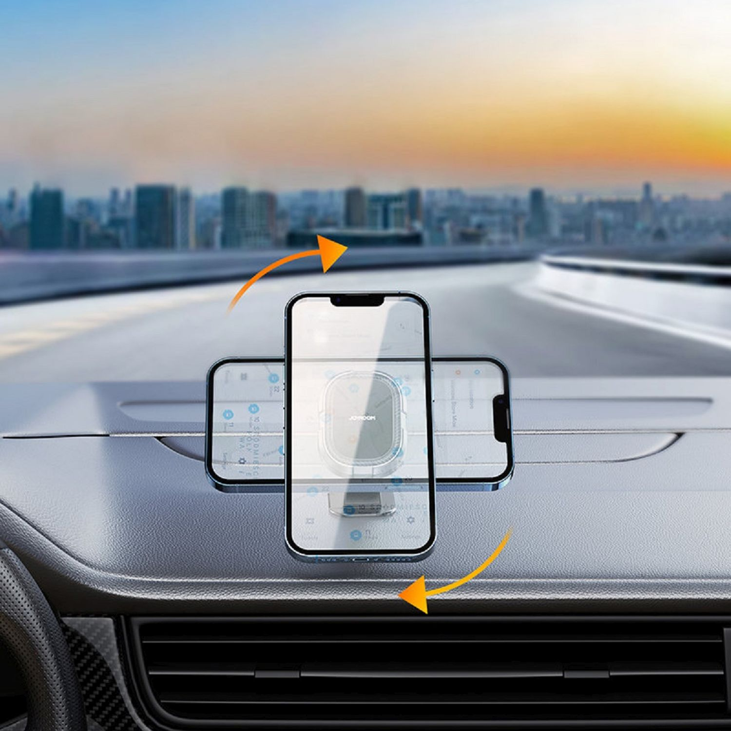 Telefon w uchwycie samochodowym, z panoramą miasta w tle. Są pomarańczowe strzałki.