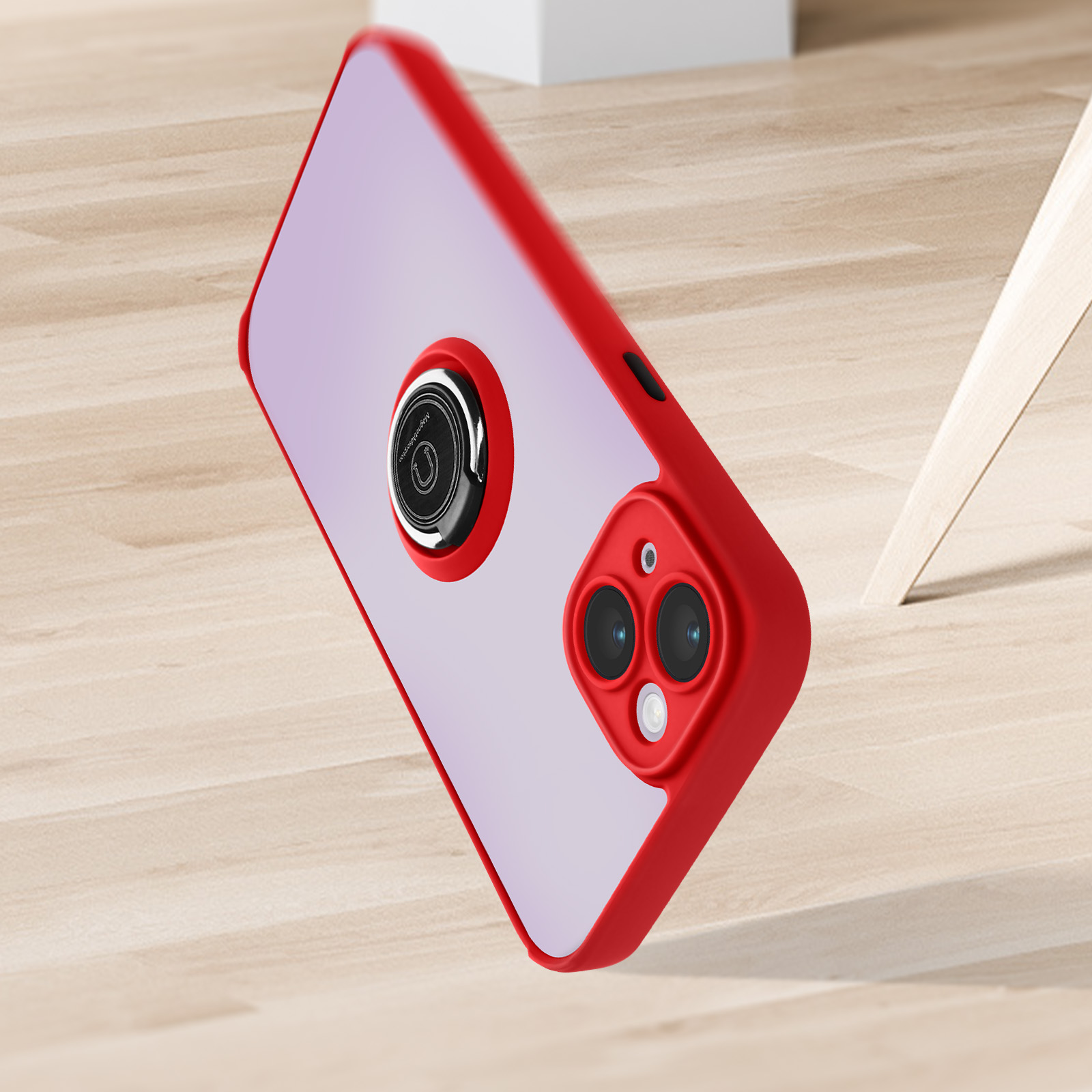Coque de téléphone rouge avec anneau, sur surface en bois. Boîte blanche floue en arrière-plan.