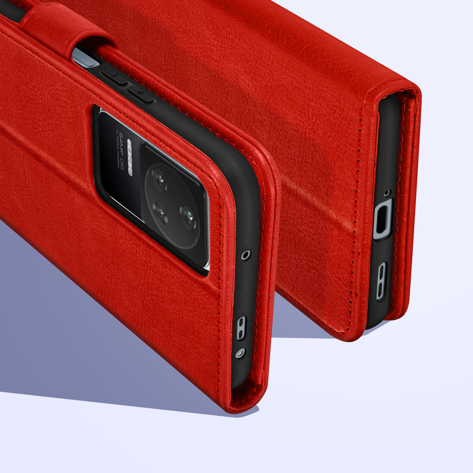 Una custodia rossa per telefono, aperta, con un telefono dentro. Primo piano.