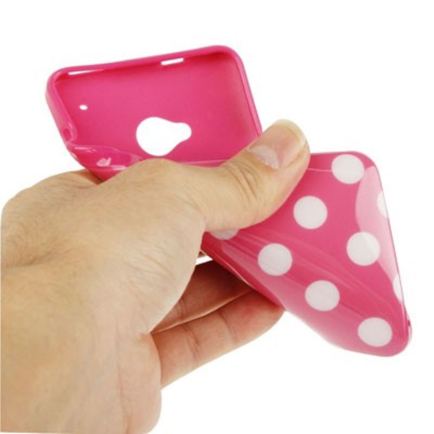 Hand hält eine pinkfarbene Handyhülle mit weißen Punkten. Die Hülle ist offen.