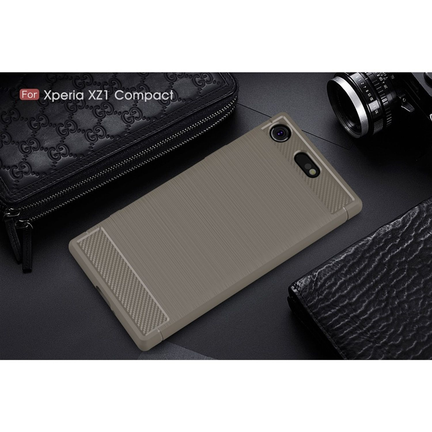 Eine graue Handyhülle mit strukturierter Oberfläche, beschriftet mit "Für Xperia XZ1 Compact". Es liegt auf einer dunklen Oberfläche.