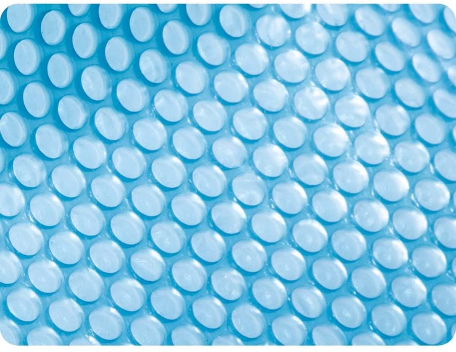 Nahaufnahme einer blauen Kunststofffolie mit vielen kleinen kreisförmigen Erhebungen, die Blasen ähneln.