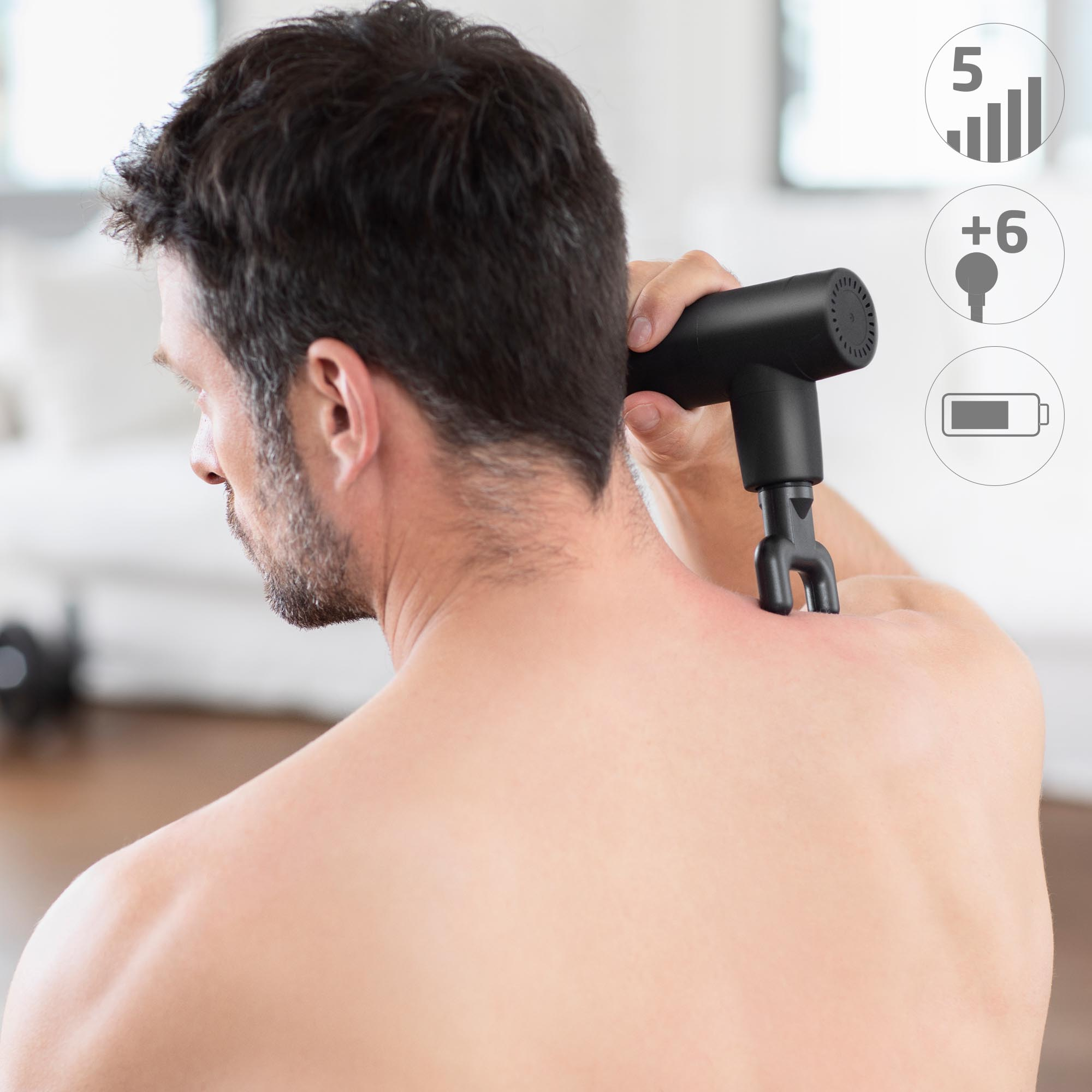 Man receiving back massage with black massager, icons: 5 bars, +6, and battery.