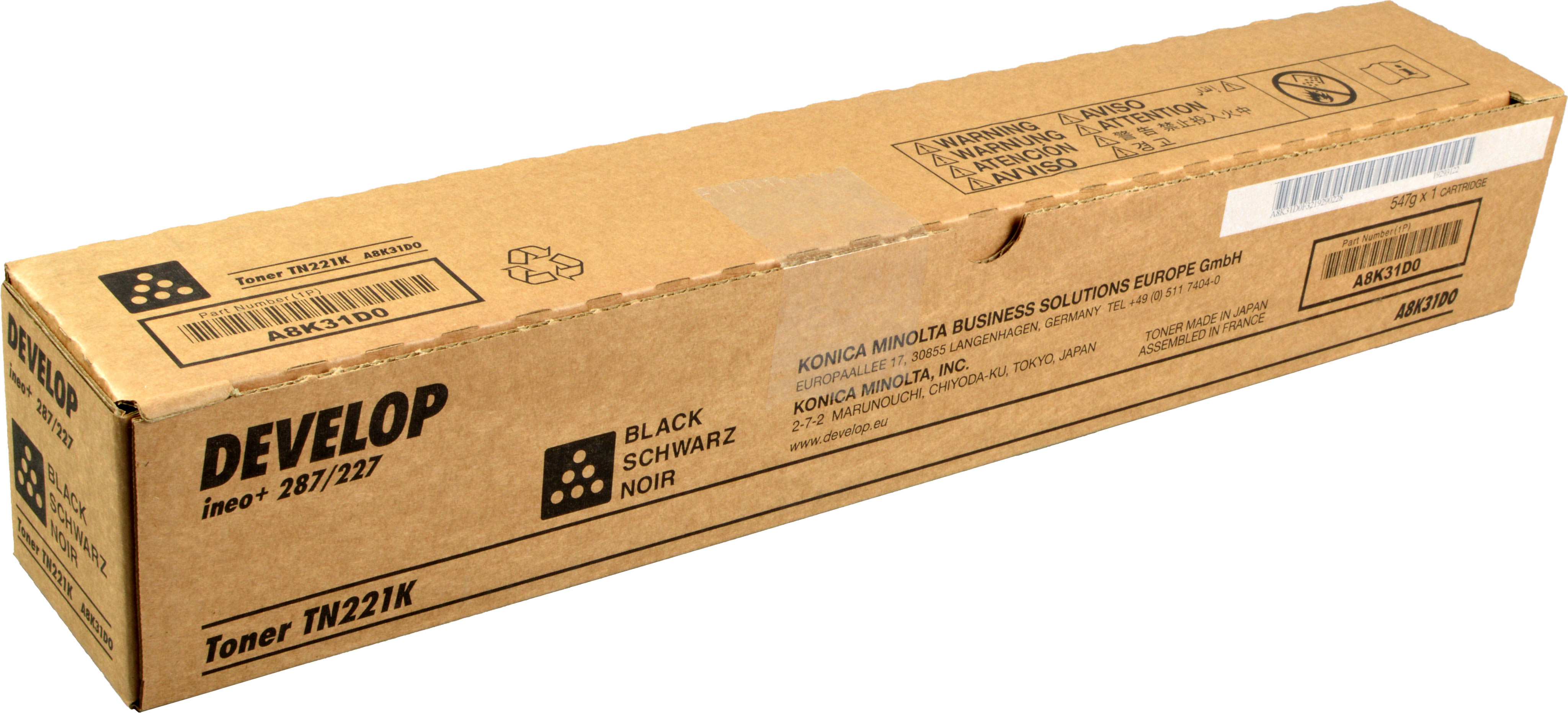 Scatola marrone con marchio DEVELOP e testo. La scatola dice: Toner TN221K, Nero Schwarz e altri dettagli.