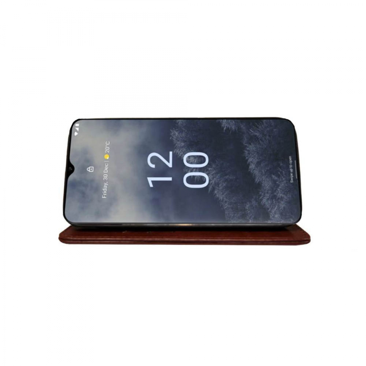 Ein Smartphone, das Zeit und Datum anzeigt, liegt auf einer braunen Oberfläche.