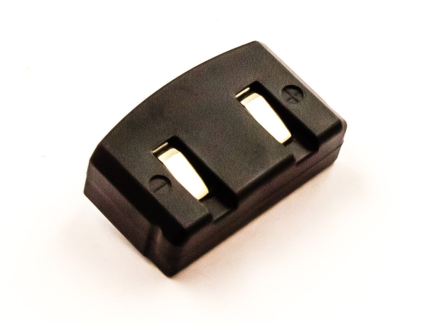 Ein schwarzes Gerät mit zwei Schlitzen und Goldkontakten auf weißem Hintergrund, schräge Aufnahme.