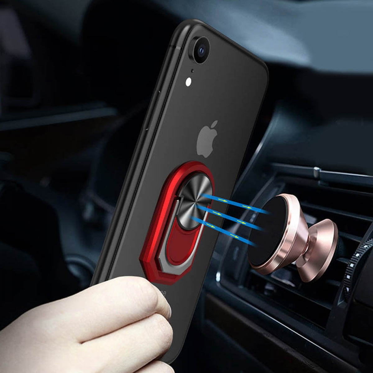 Eine Hand, die ein Telefon mit einem Ringhalter an der Rückseite hält, neben einer Auto-Lüftungsöffnung.