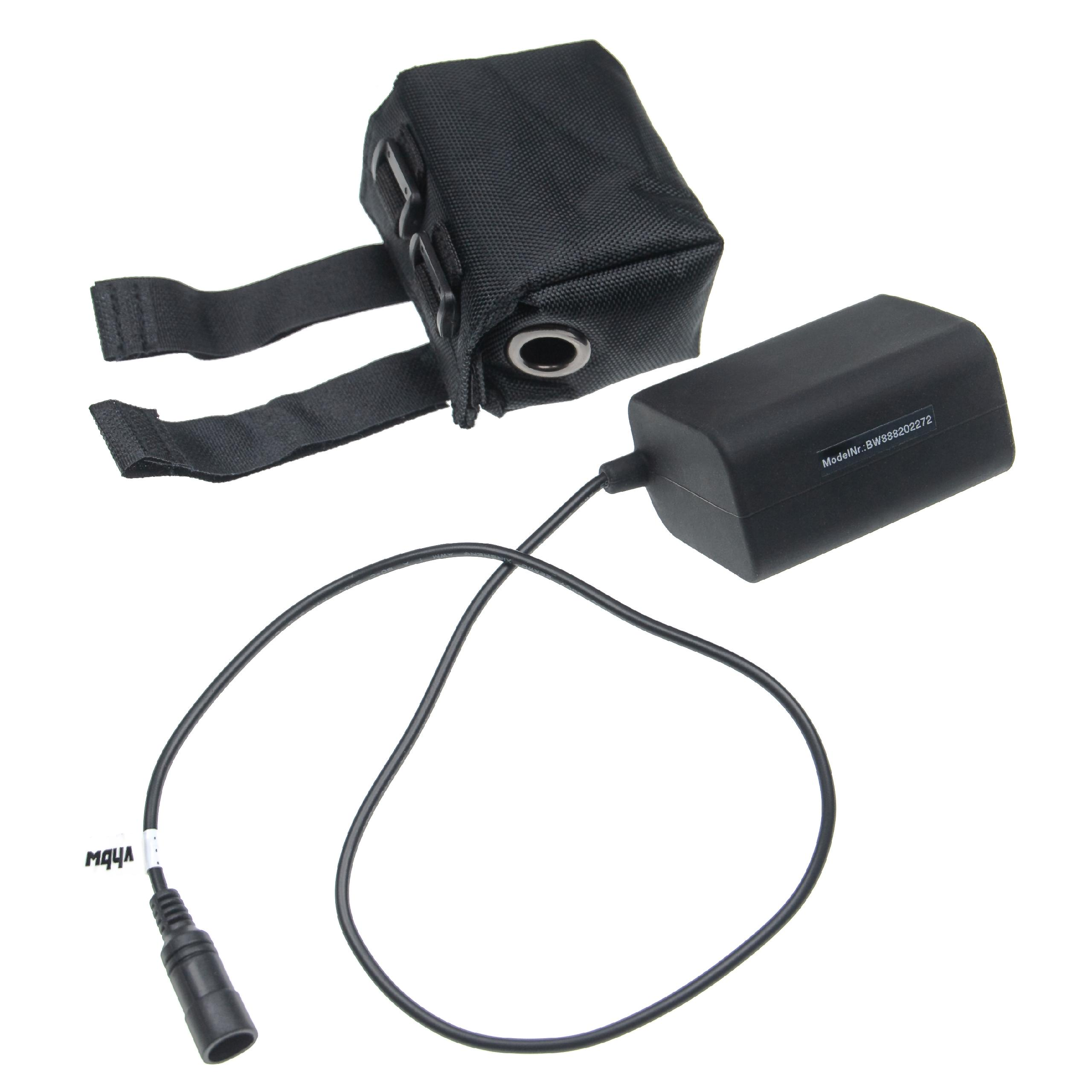 Schwarzes Akkupack mit Kabel und schwarzem Beutel. Der Beutel hat Träger und ist mit dem Akku verbunden.