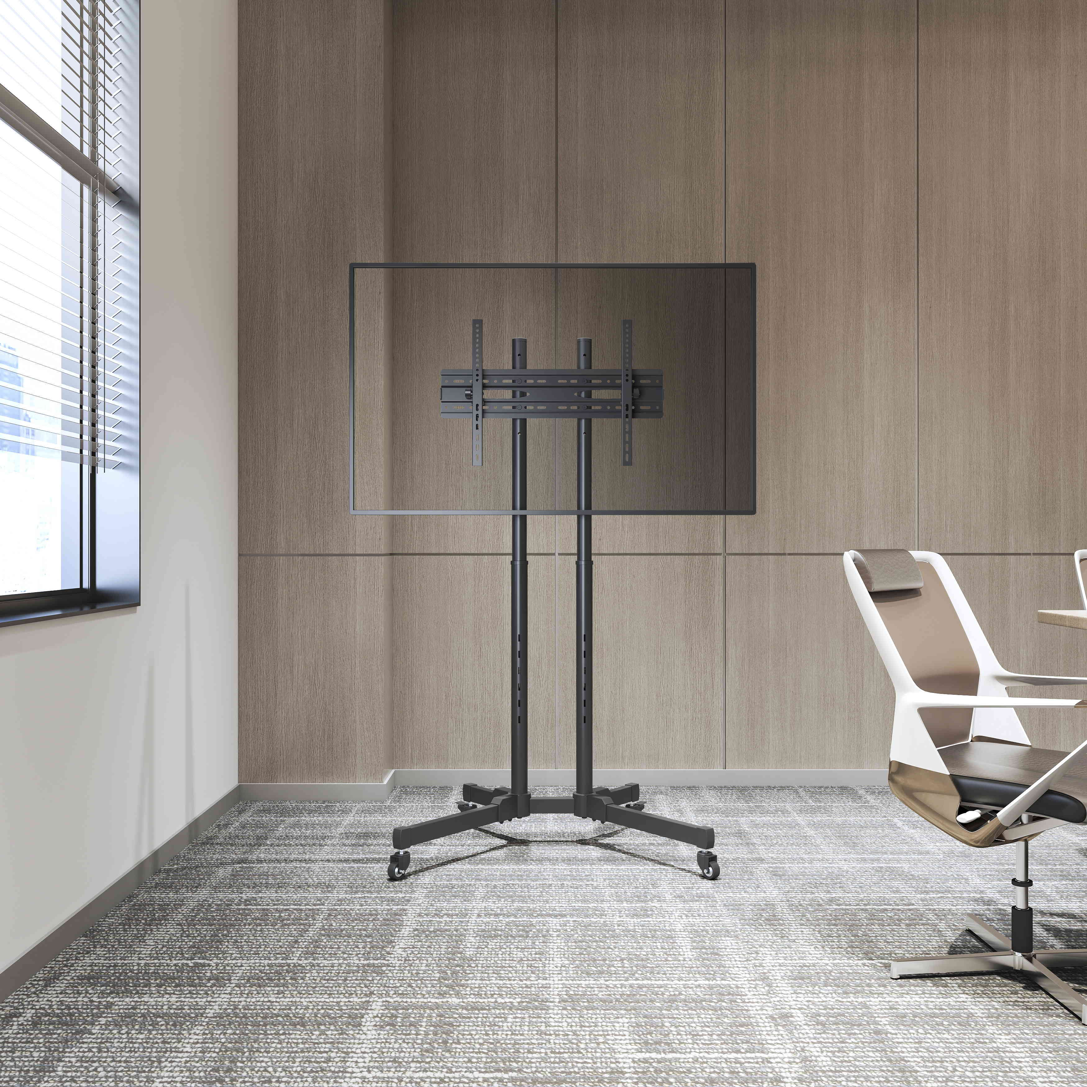 TV stand with a screen, and a white and brown chair in a room with a window and wooden paneling.