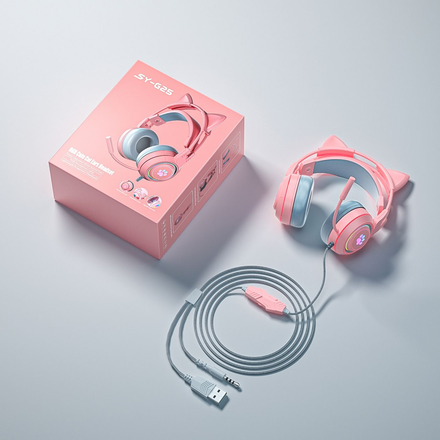 Rosa Katzenohrhörer und ihre Verpackung. Graues Kabel mit Lautstärkeregler und USB-Stecker.