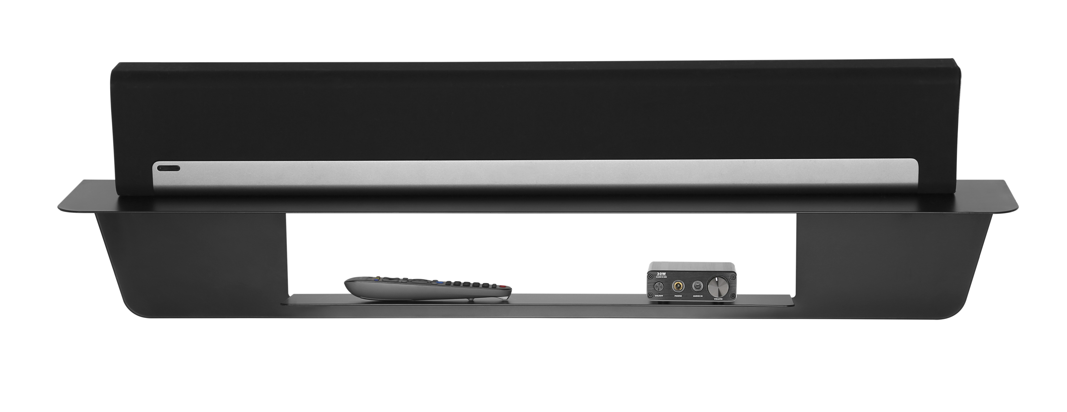 A black soundbar mounted on a black shelf with a remote and other device.