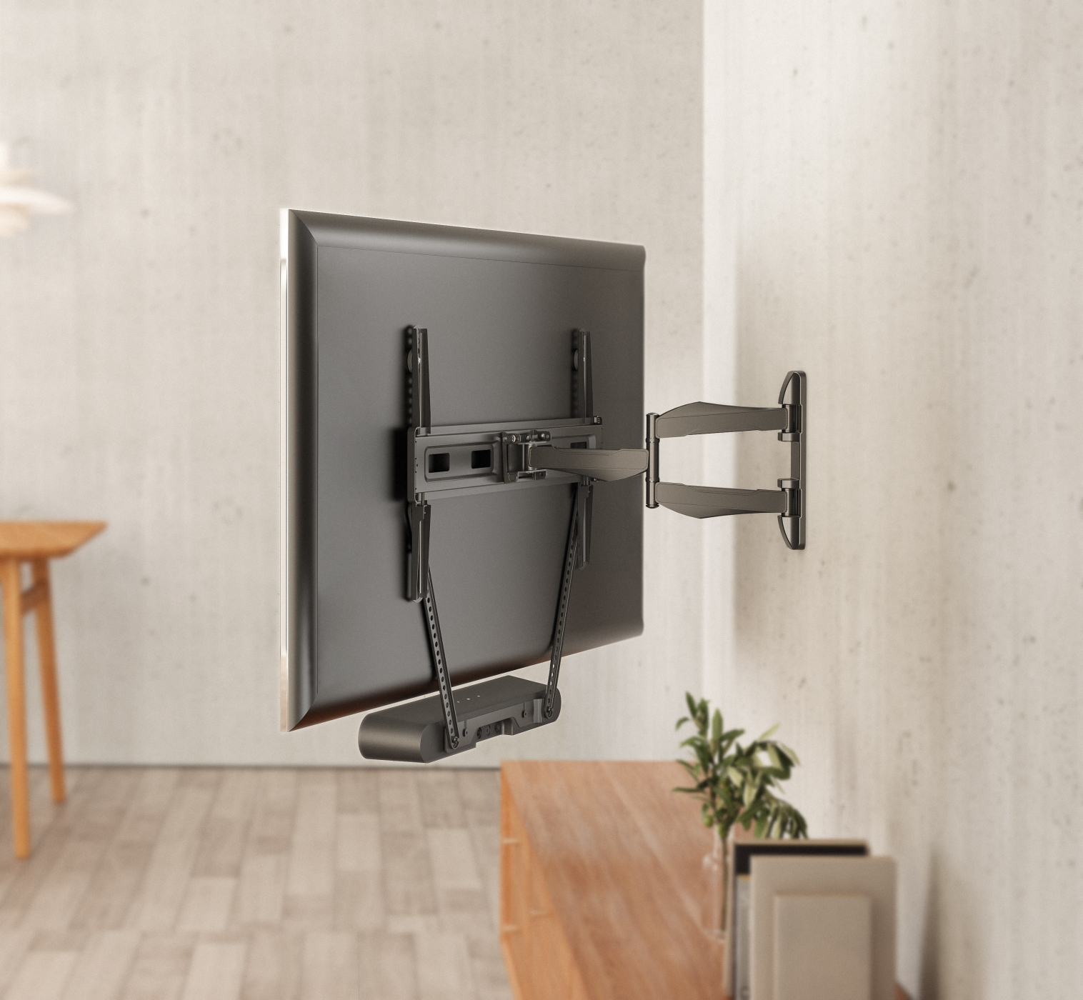 A TV mounted on a wall, seen from the back. The mount and a soundbar are visible.
