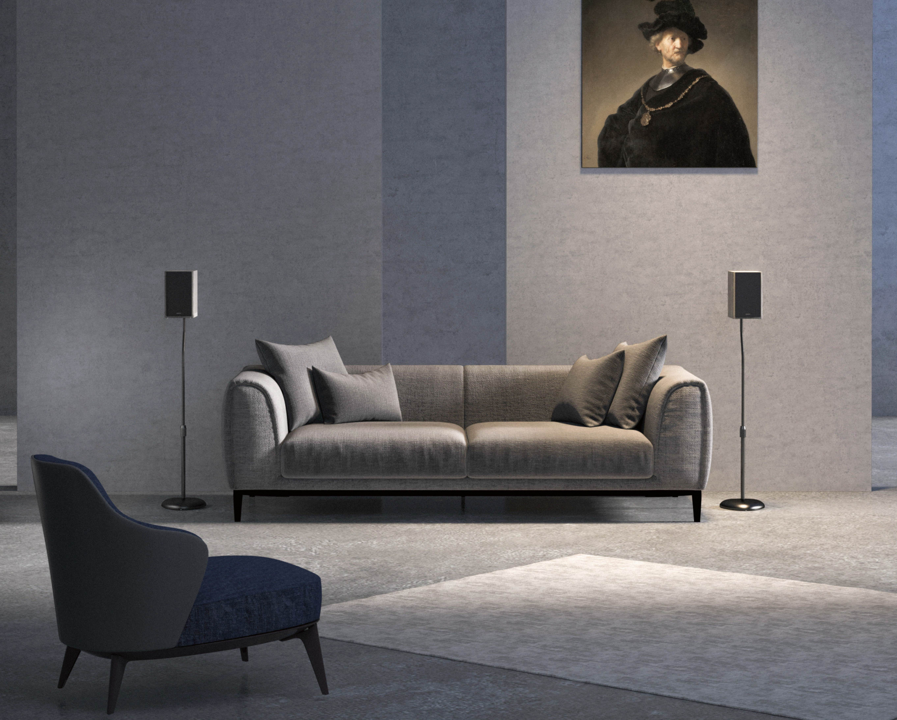A living room with a gray sofa, two speakers, and a painting above. A blue chair is on the left.