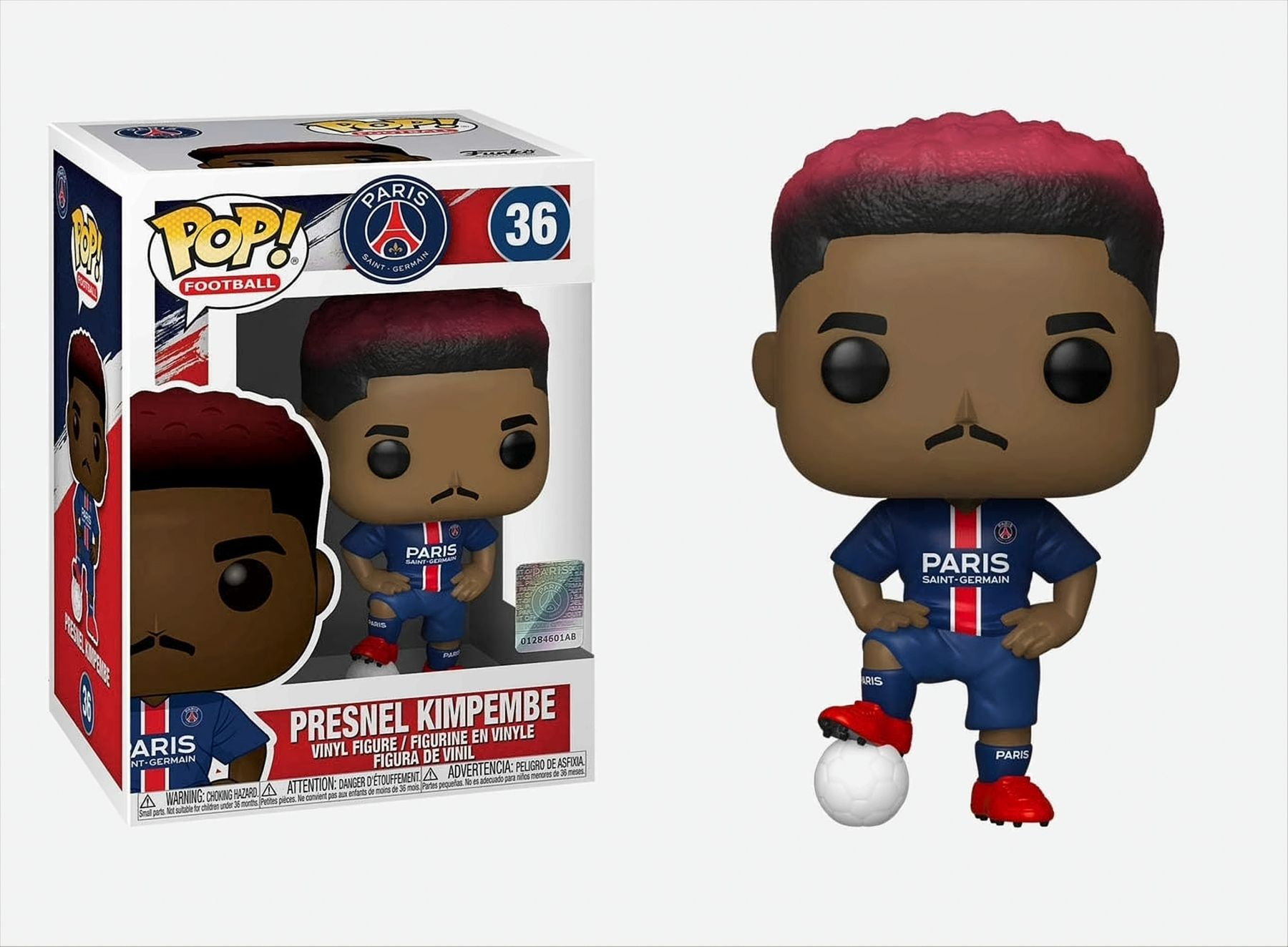 Funko Pop di Presnel Kimpembe in scatola. Figura di un calciatore con capelli rossi e un pallone.