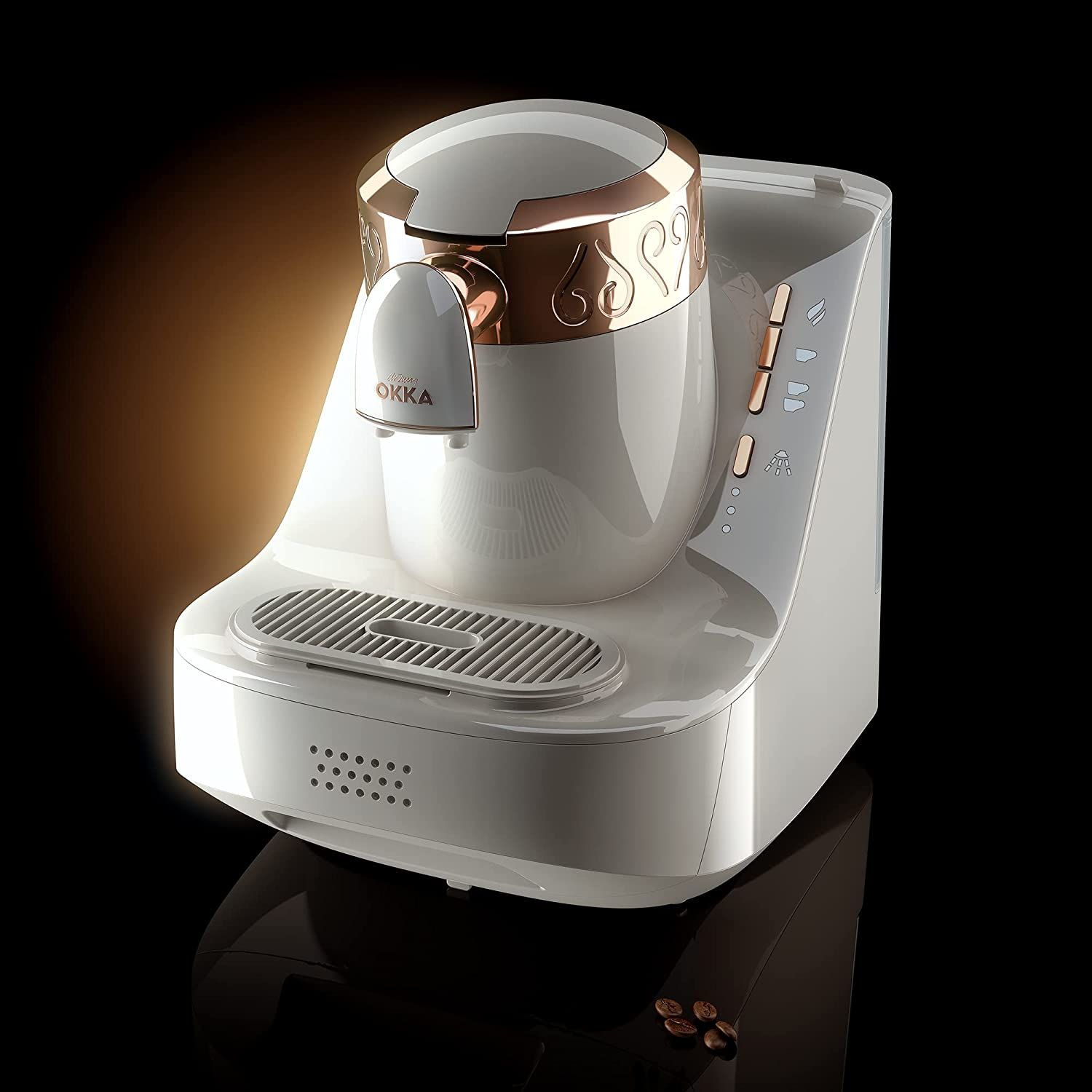 Weißer und goldener Kaffeevollautomat auf schwarzer Oberfläche mit warmem Glanz.