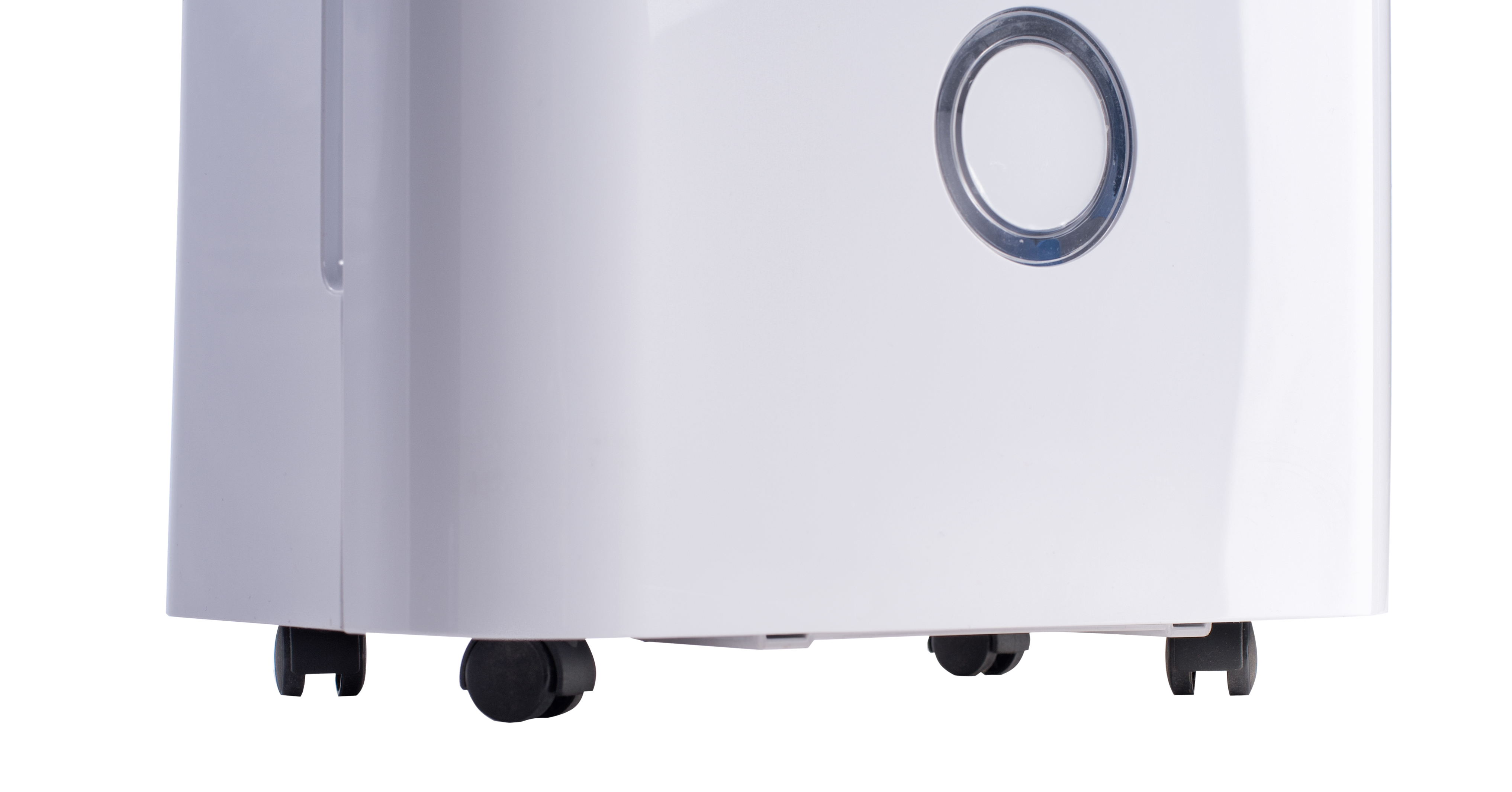 Białe urządzenie z zaokrąglonymi narożnikami i czarnymi kołami. Okrągły detal.