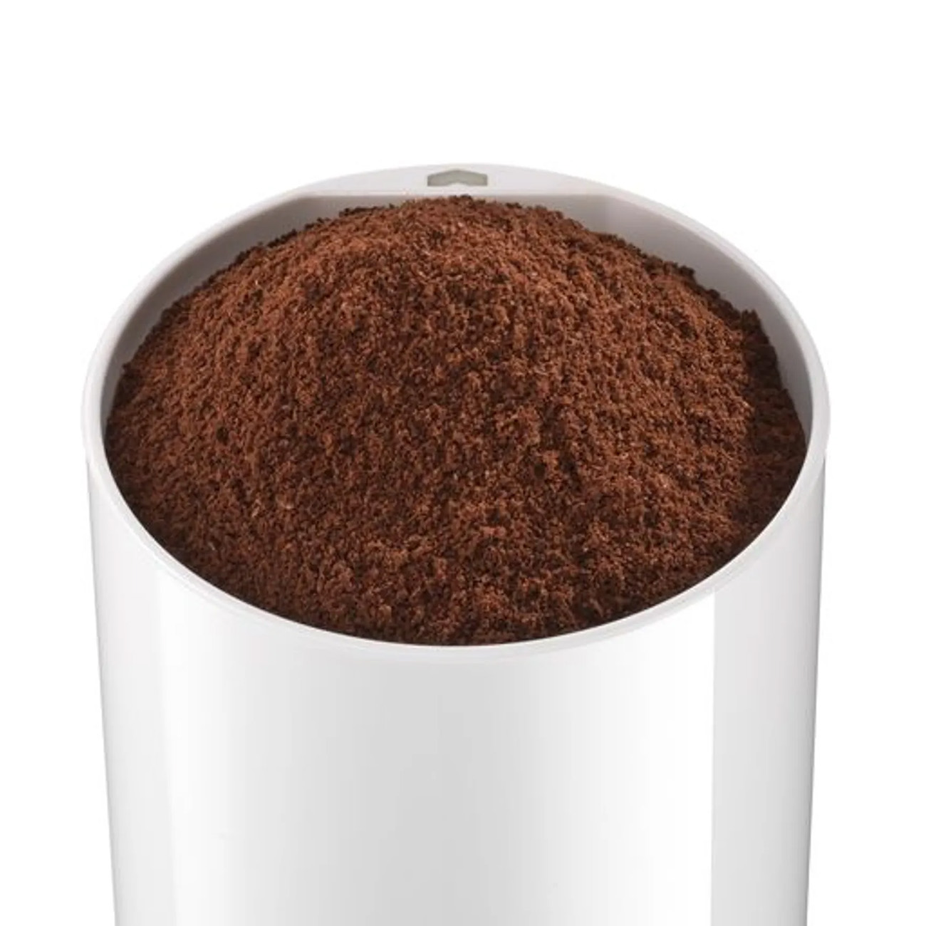 A white container filled with brown ground coffee, seen from above.