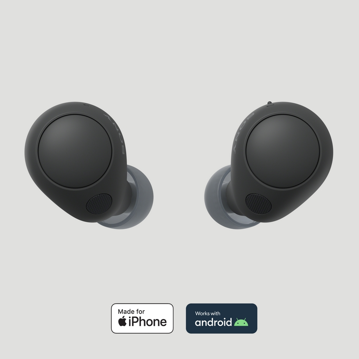 Dos auriculares negros con puntas grises. Hecho para iPhone y compatible con Android.