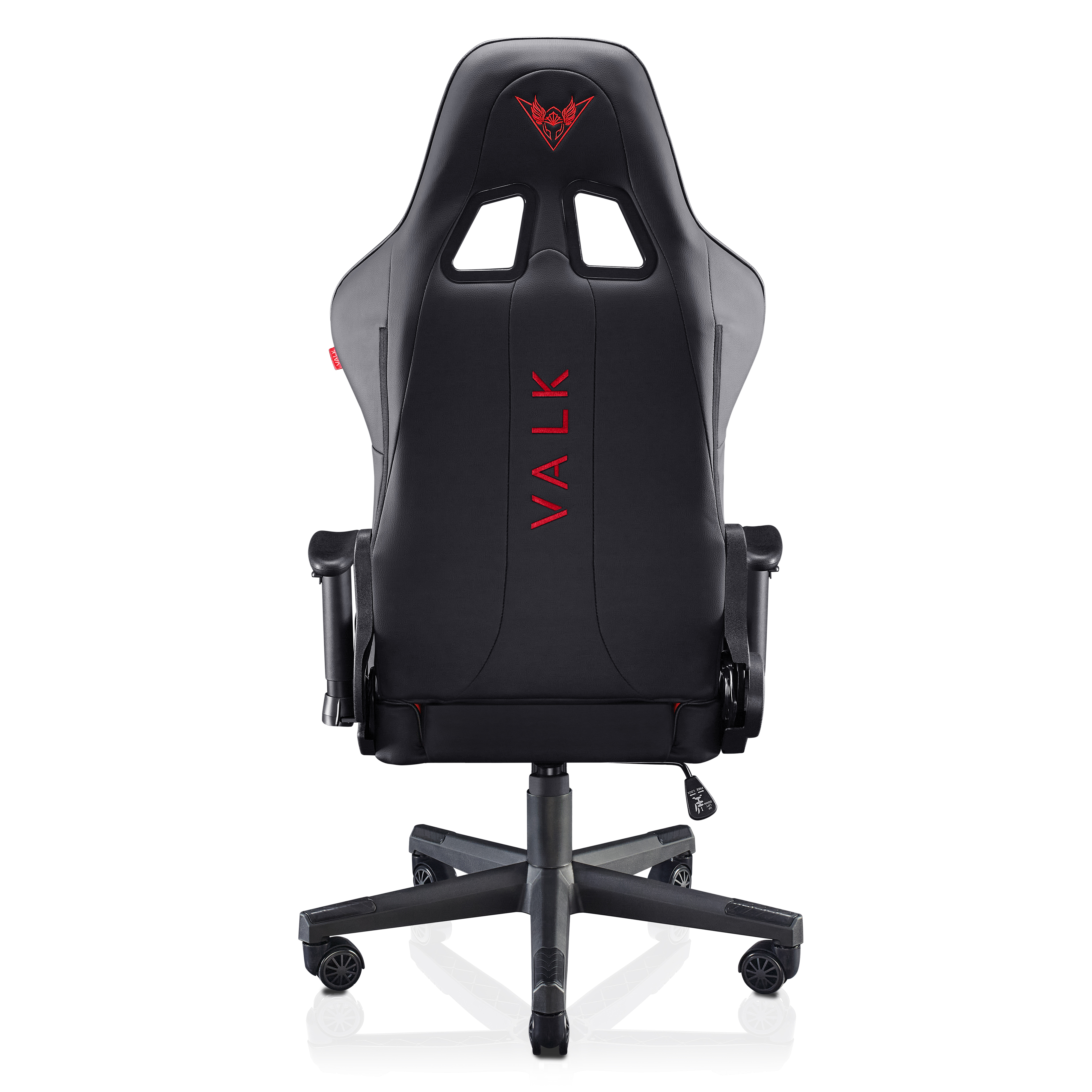 Silla gaming negra, vista trasera. Texto VALK rojo en el respaldo. Logotipo rojo en la parte superior. Base y ruedas negras.
